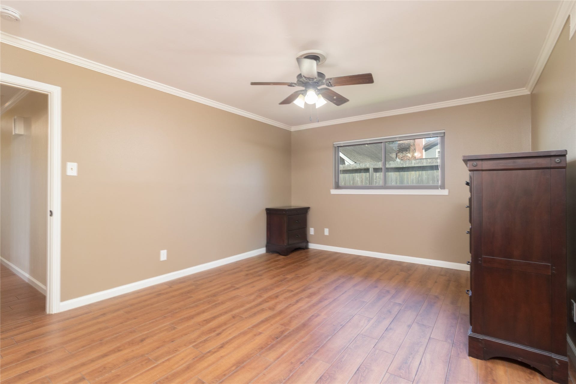 8919 Manhattan Drive, Houston, TX 77096 Primary suite includes additional living space and convenient access toward the bath and backyard.