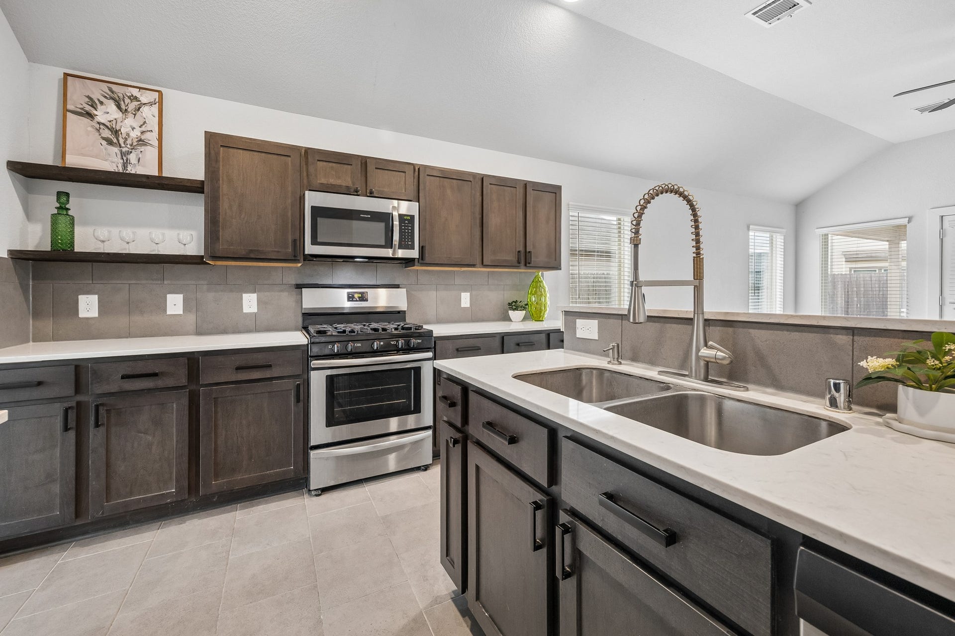 Rich wooden shaker cabinets warm the heart of the home.