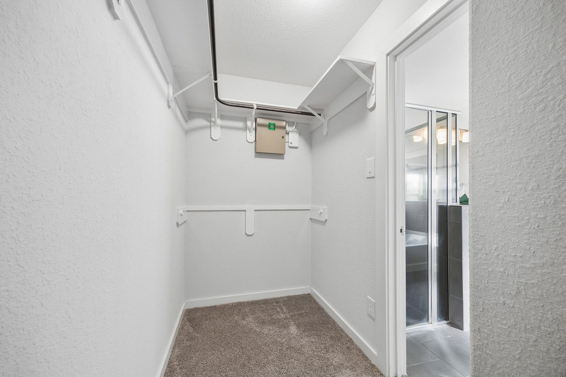 A large walk in closet for a shoppers delight.