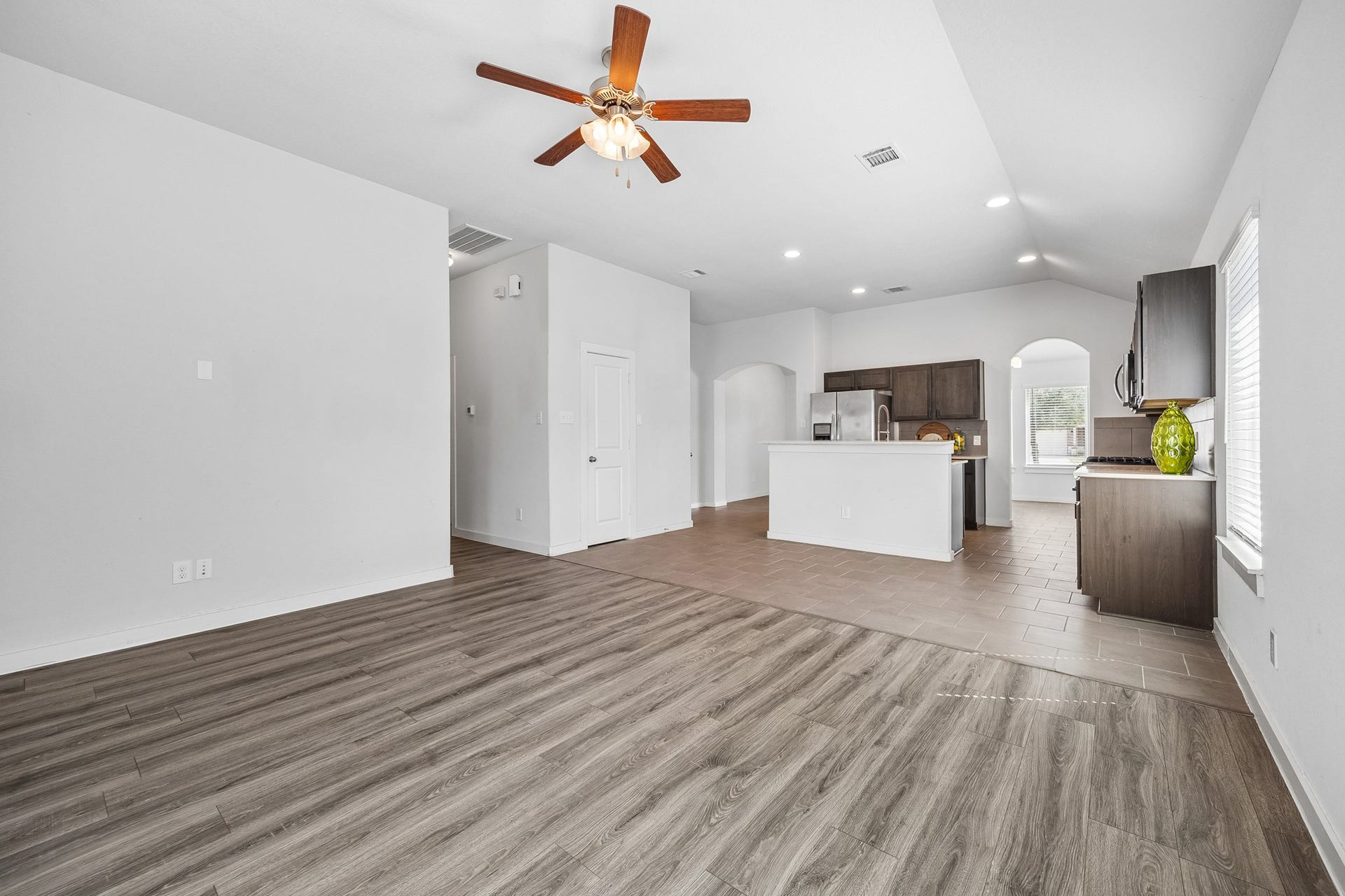 Luxury flooring flows seamlessly across all main living areas.