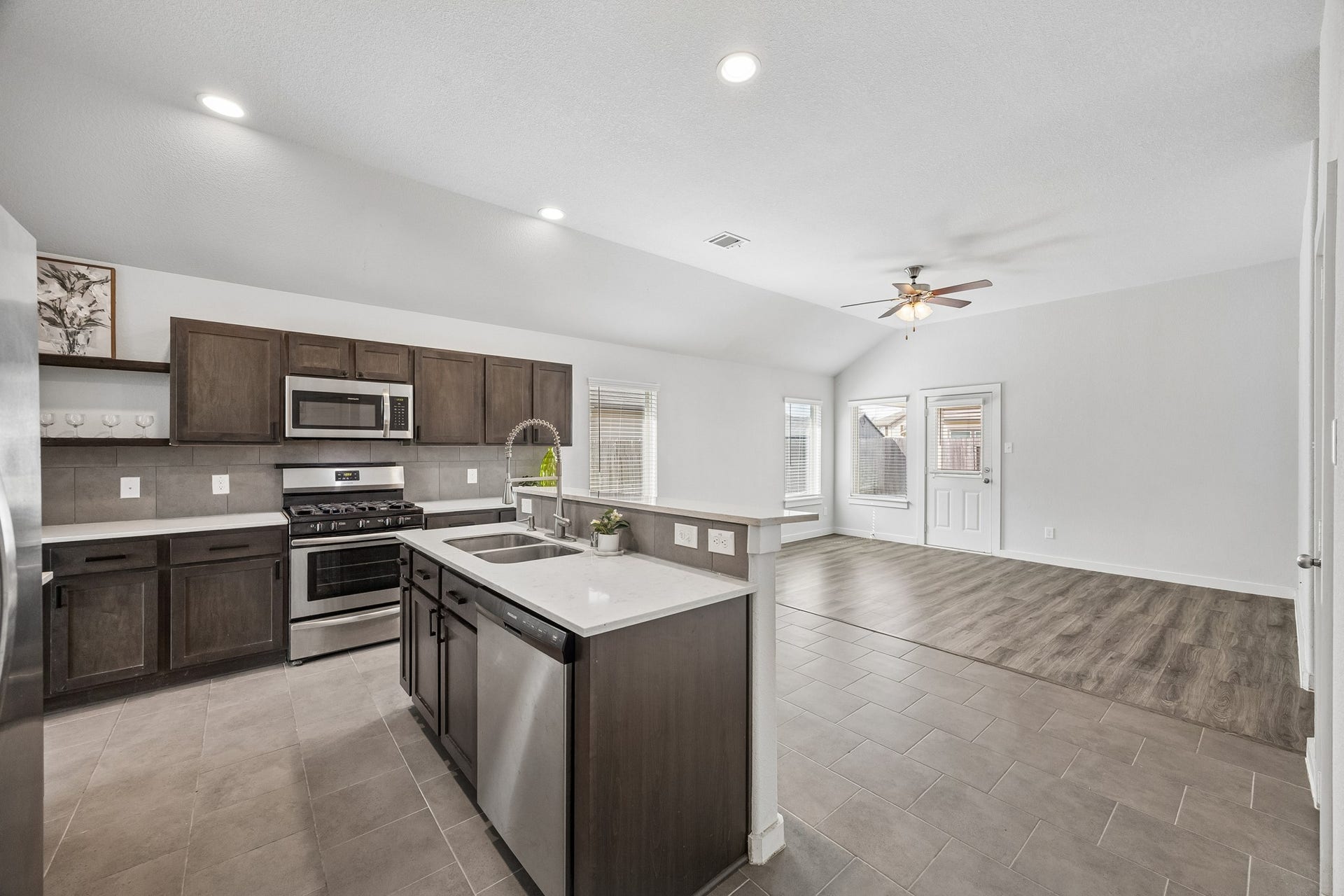 Open concept and island seating create a spacious and connected feeling across the main living spaces.