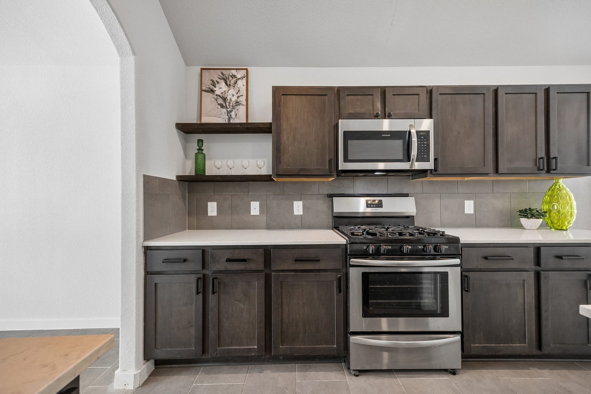 Stainless appliances and gas range are a chefs playground.