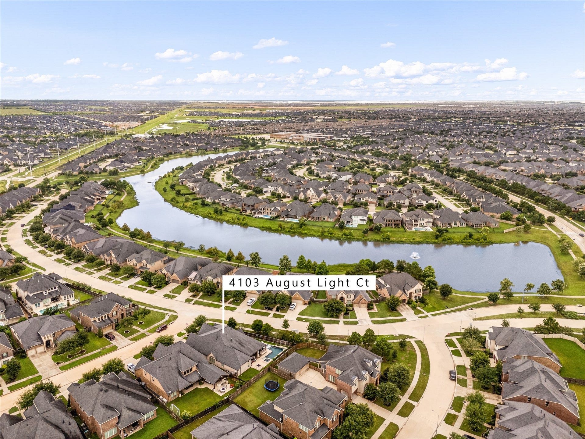 4103 August Light Court, Fulshear, TX 77441 Offering an expansive backyard transition right to the water and beautiful, long-range lake views from multiple angles, this exceptional site truly captures the very best of upscale master-planned living.