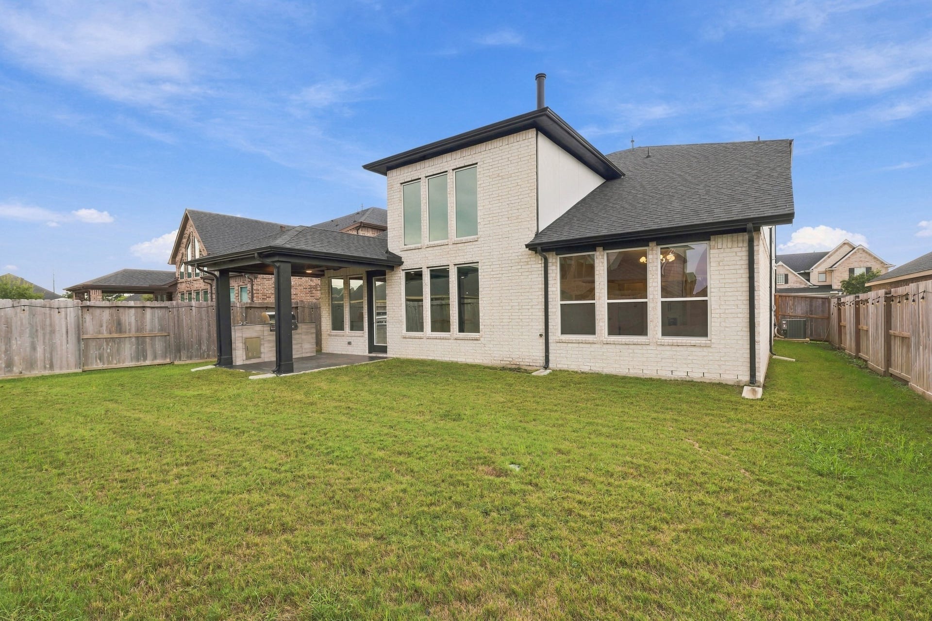 31539 Beacon Cove Trail, Fulshear, TX 77441 A fully fenced lawn completes the property with room for outdoor dining, recreation or future personalization.