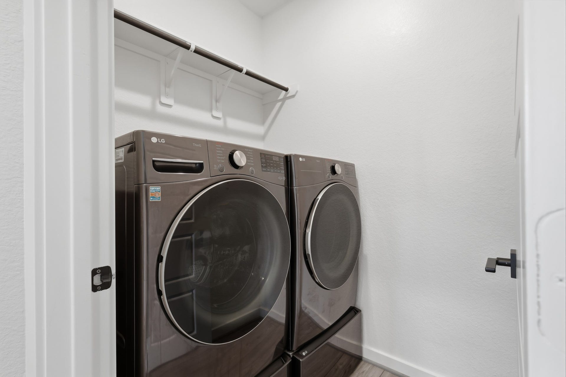 31539 Beacon Cove Trail, Fulshear, TX 77441 The utility room comes fully equipped with an included washer and dryer on pedestals.