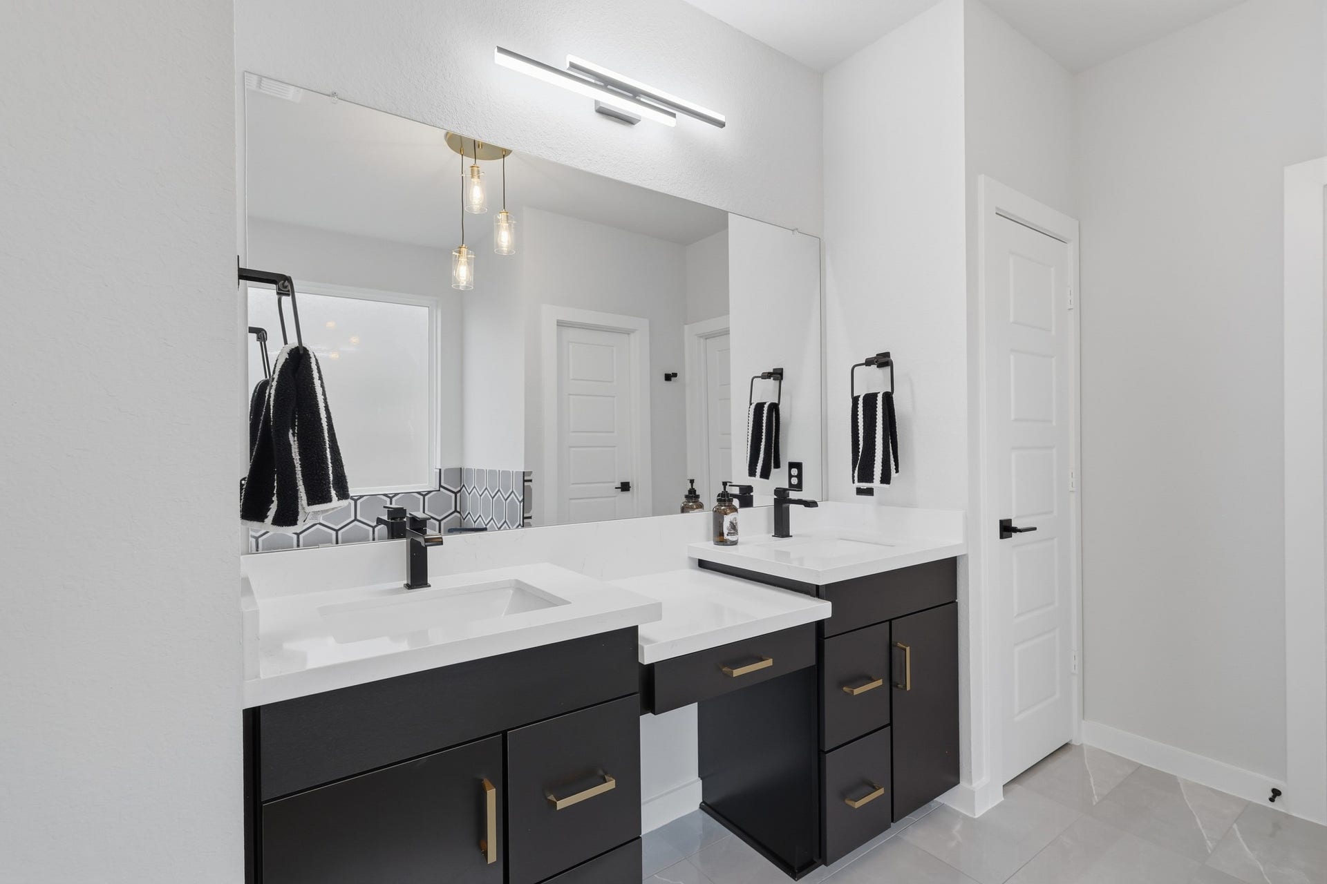 31539 Beacon Cove Trail, Fulshear, TX 77441 Separate vanity areas provide additional storage and personal space.
