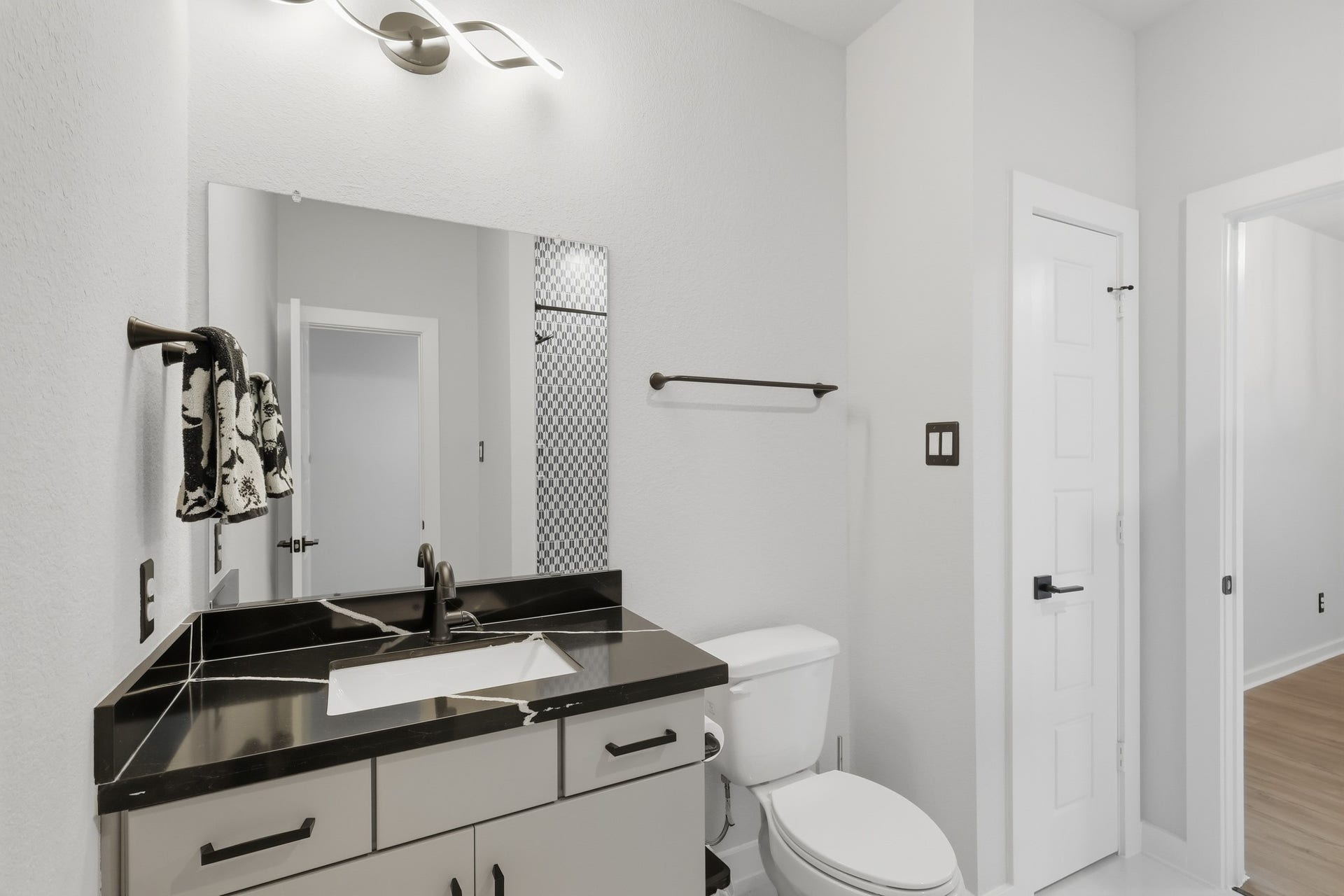 31539 Beacon Cove Trail, Fulshear, TX 77441 A spacious vanity provides useful storage and counter space for both upstairs bedrooms.