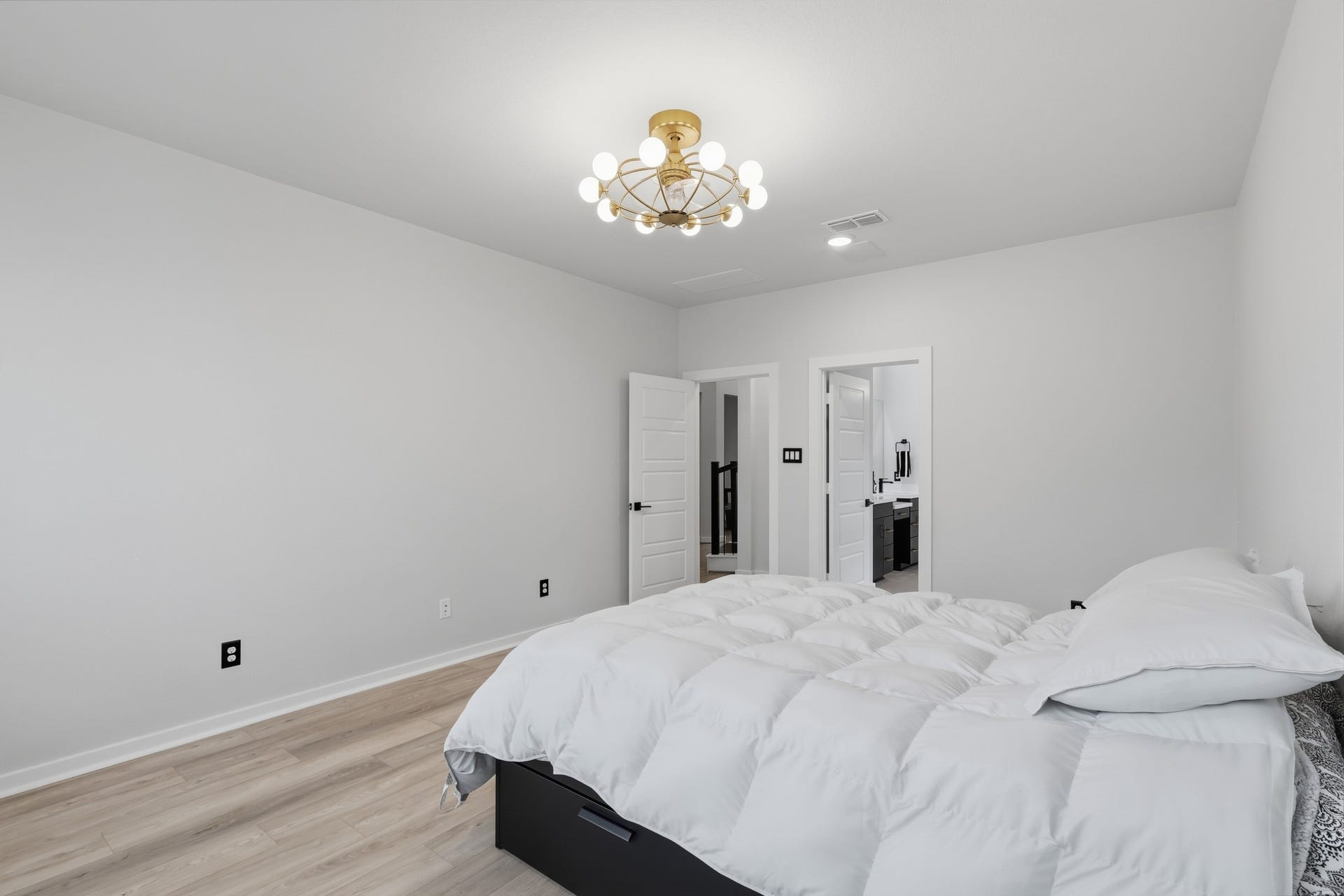 31539 Beacon Cove Trail, Fulshear, TX 77441 The suite offers ample room for a complete bedroom arrangement while maintaining an open and comfortable feel.