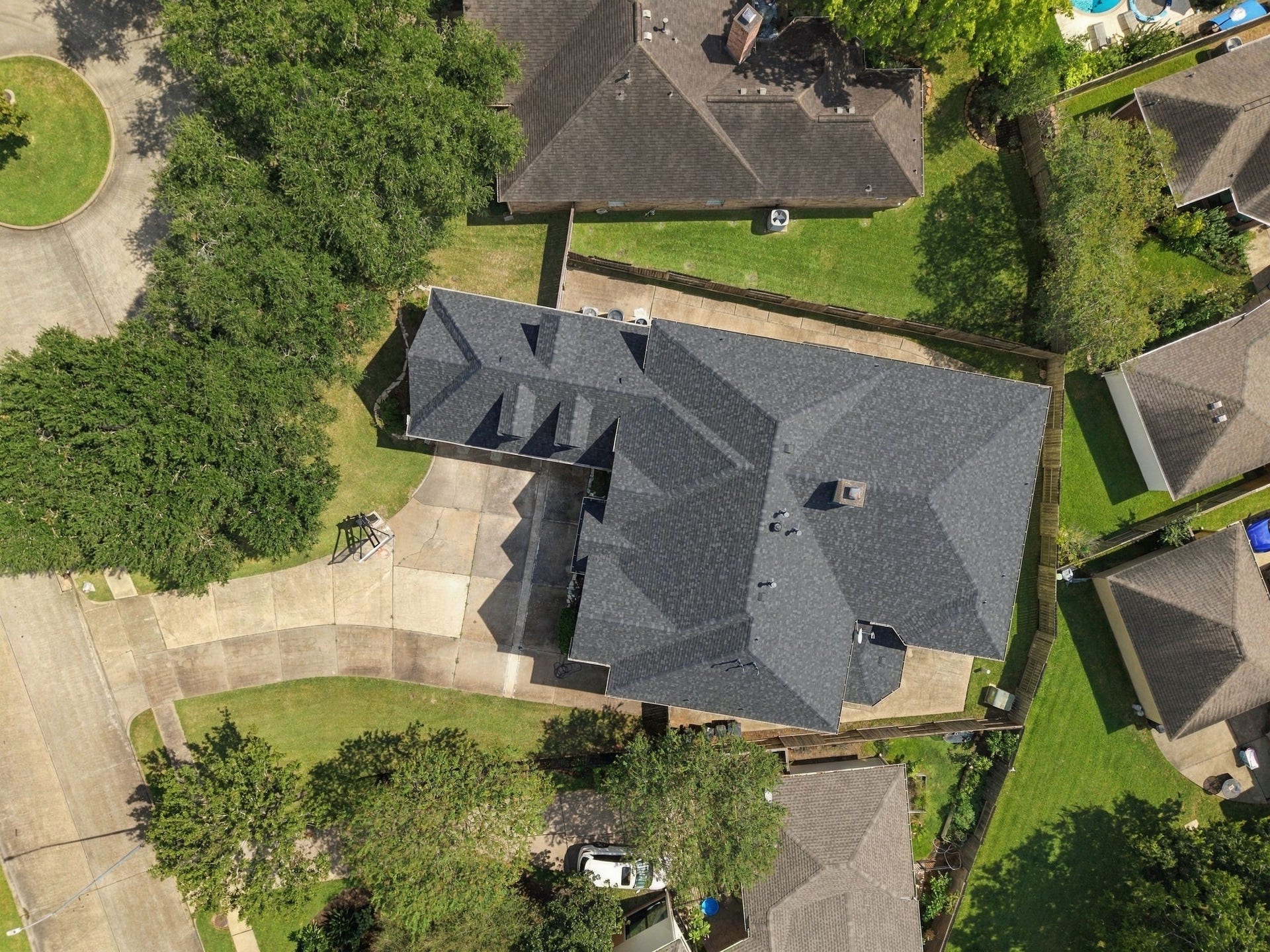 7610 Northwoods Drive, Sugar Land, TX 77479 This aerial perspective highlights the homes commanding footprint, extensive driveway and surrounding outdoor spaceall designed to give you more room to enjoy.