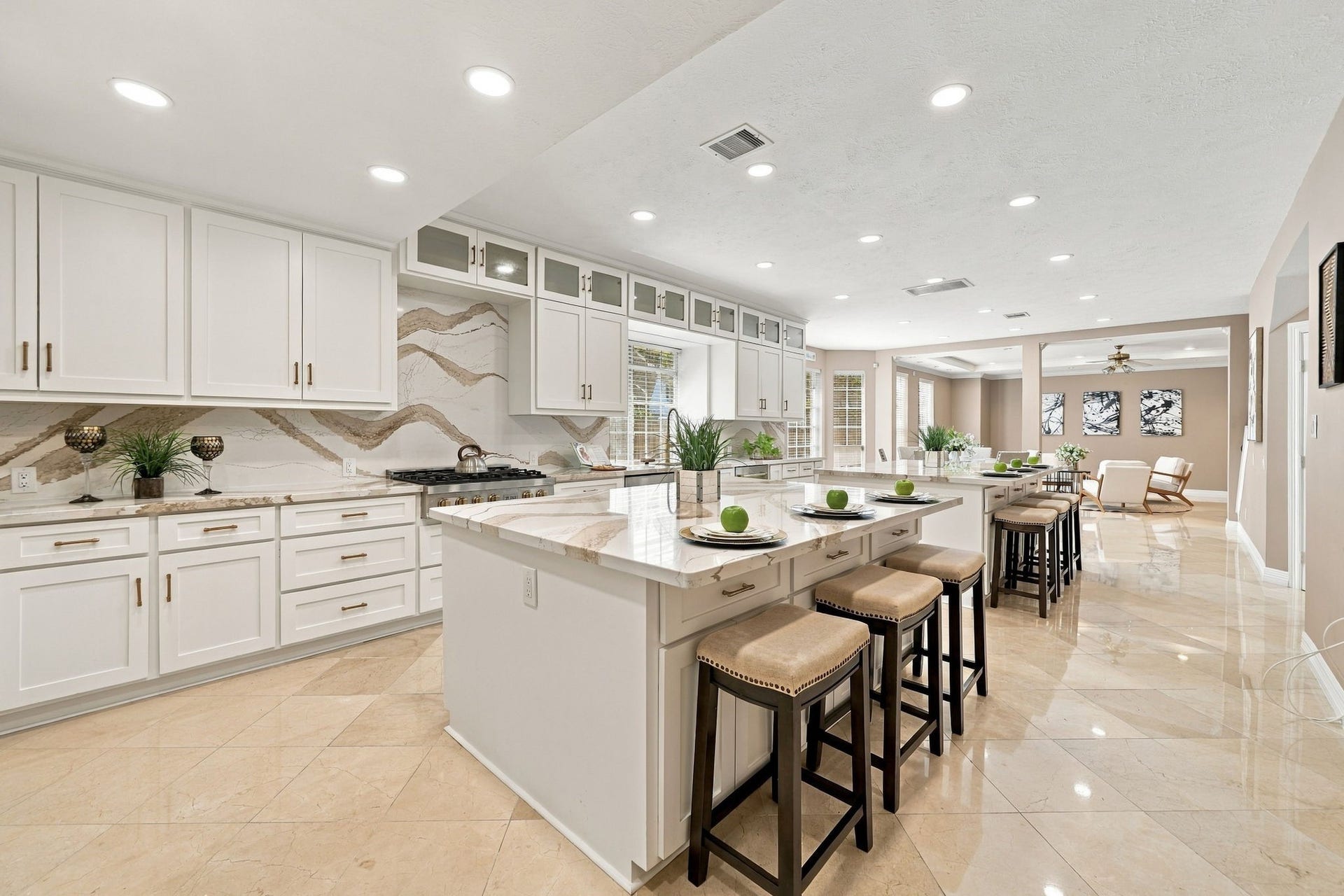 7610 Northwoods Drive, Sugar Land, TX 77479 The long sightline from the kitchen showcases a home designed for connection, with everyday spaces arranged to feel open and cohesive.