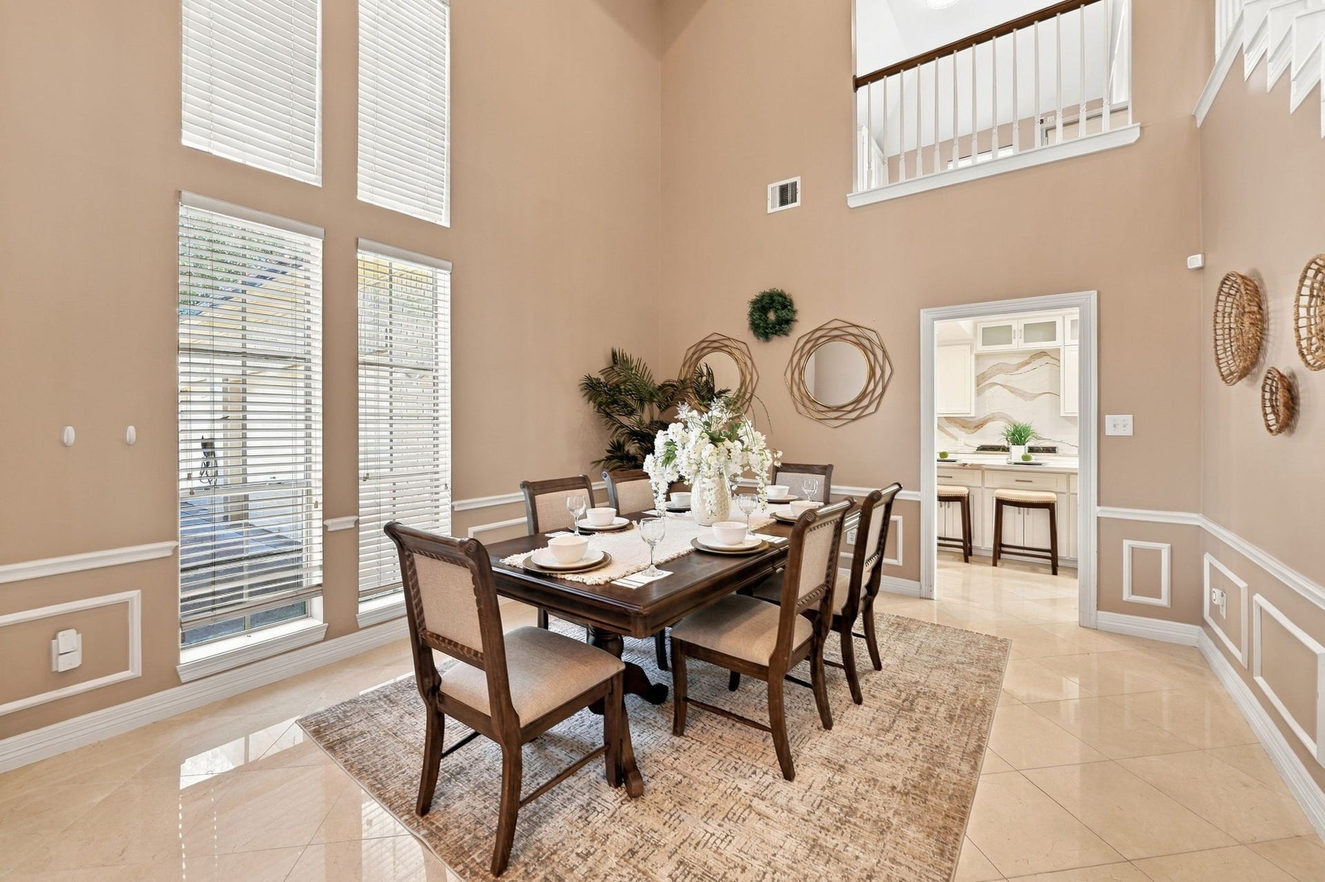 7610 Northwoods Drive, Sugar Land, TX 77479 Positioned between the grand entry and nearby kitchen, this formal dining room makes hosting feel effortless while creating an elegant setting for memorable meals.