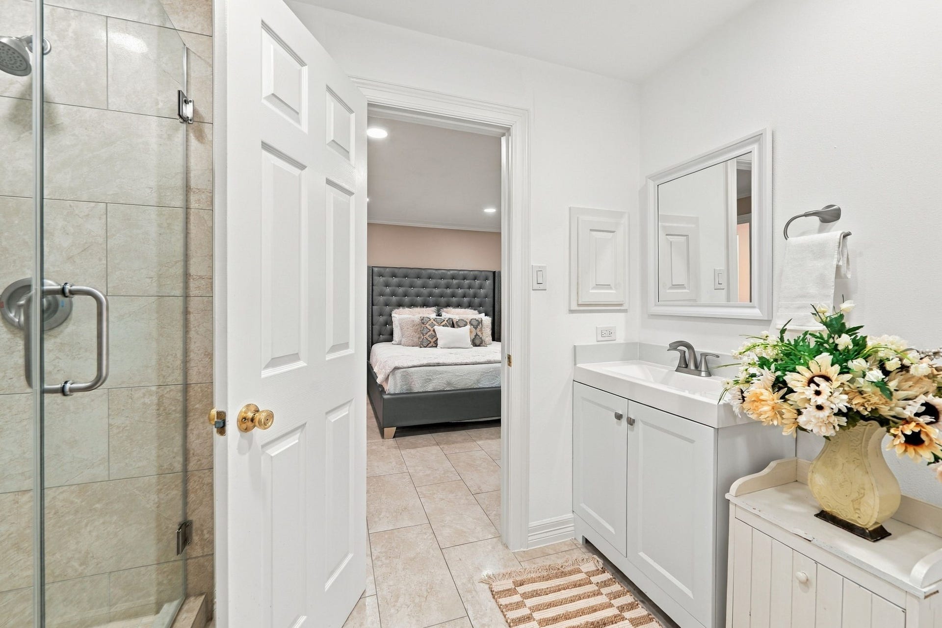 7610 Northwoods Drive, Sugar Land, TX 77479 A dedicated bath enhances Bedroom 1 with added privacy, making this space especially well suited for guests or extended stays.