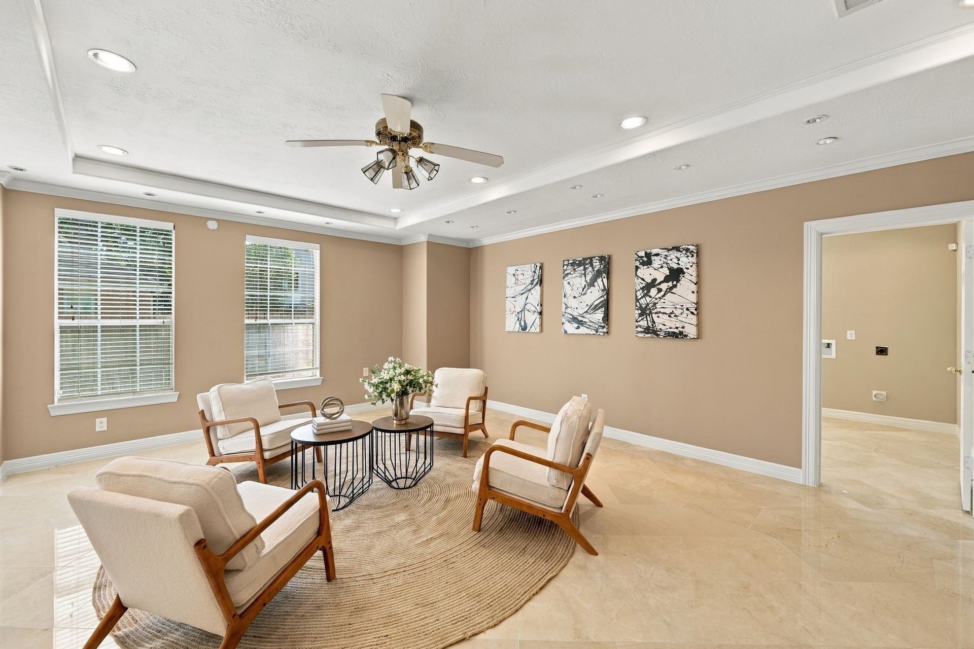 7610 Northwoods Drive, Sugar Land, TX 77479 A dedicated sitting room provides a quieter place to connect with guests, enjoy morning coffee, or simply relax away from the main gathering areas.