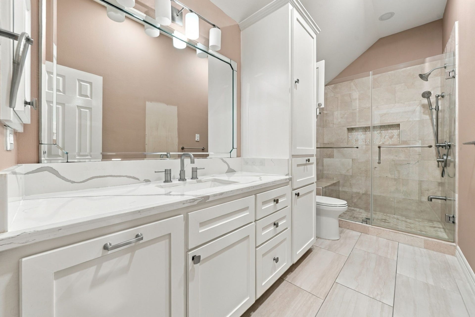 7610 Northwoods Drive, Sugar Land, TX 77479 A beautifully finished private bath makes Bedroom 5 feel like its own suite, offering comfort and privacy your guests will appreciate.