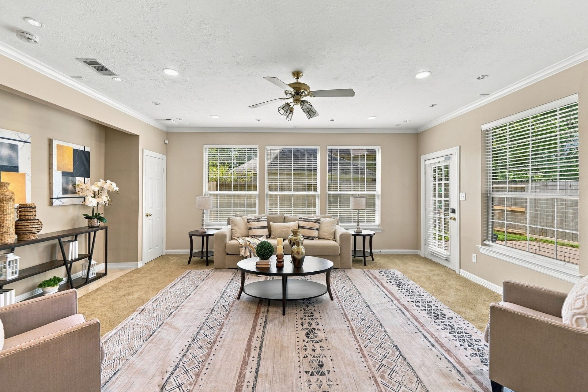 7610 Northwoods Drive, Sugar Land, TX 77479 With ample room for multiple seating areas and plenty of natural light, this family room is ready for everything from quiet weekends to lively gatherings.