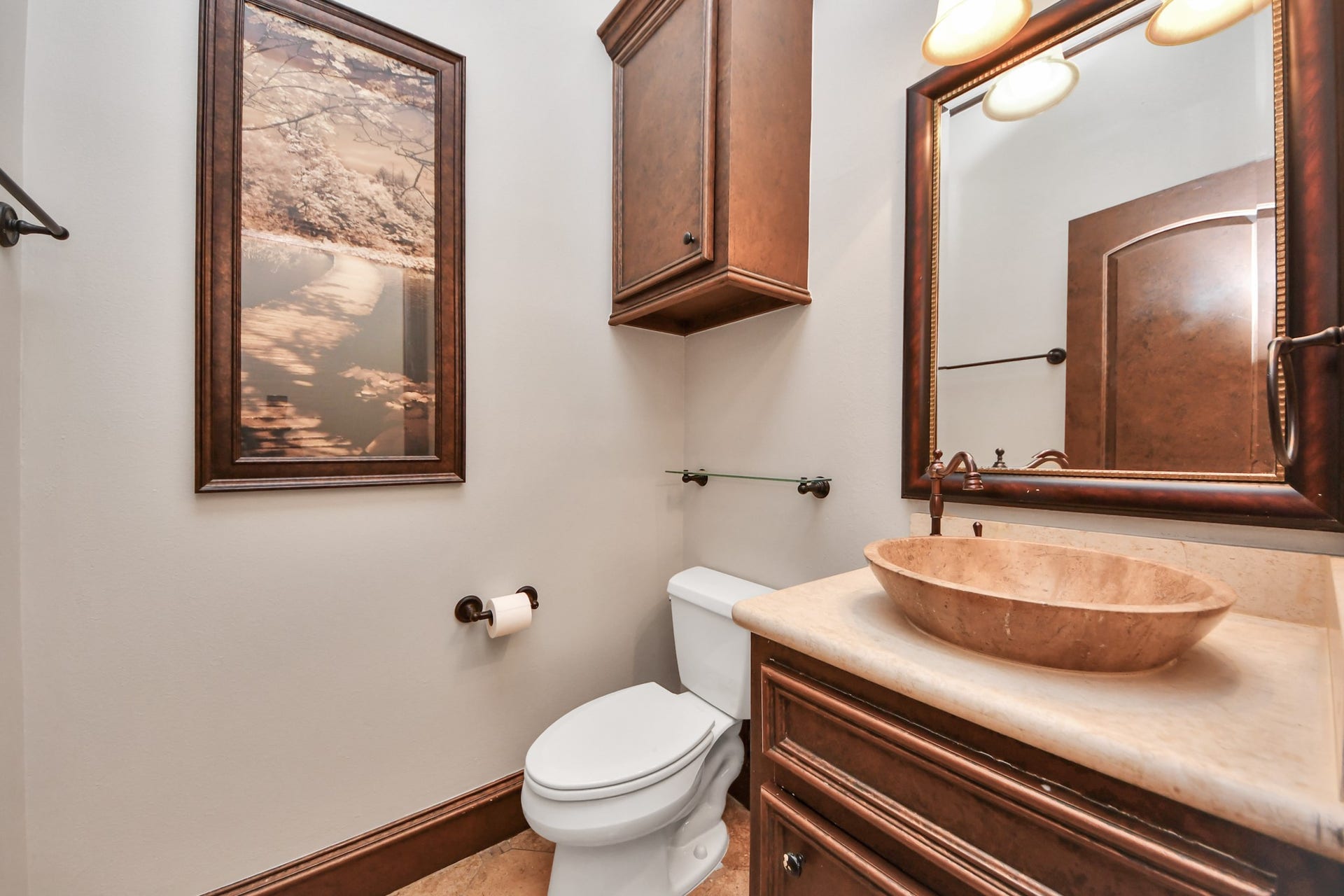 1/2 bath has unique features as well from the detail from the sink to the cabinetry.