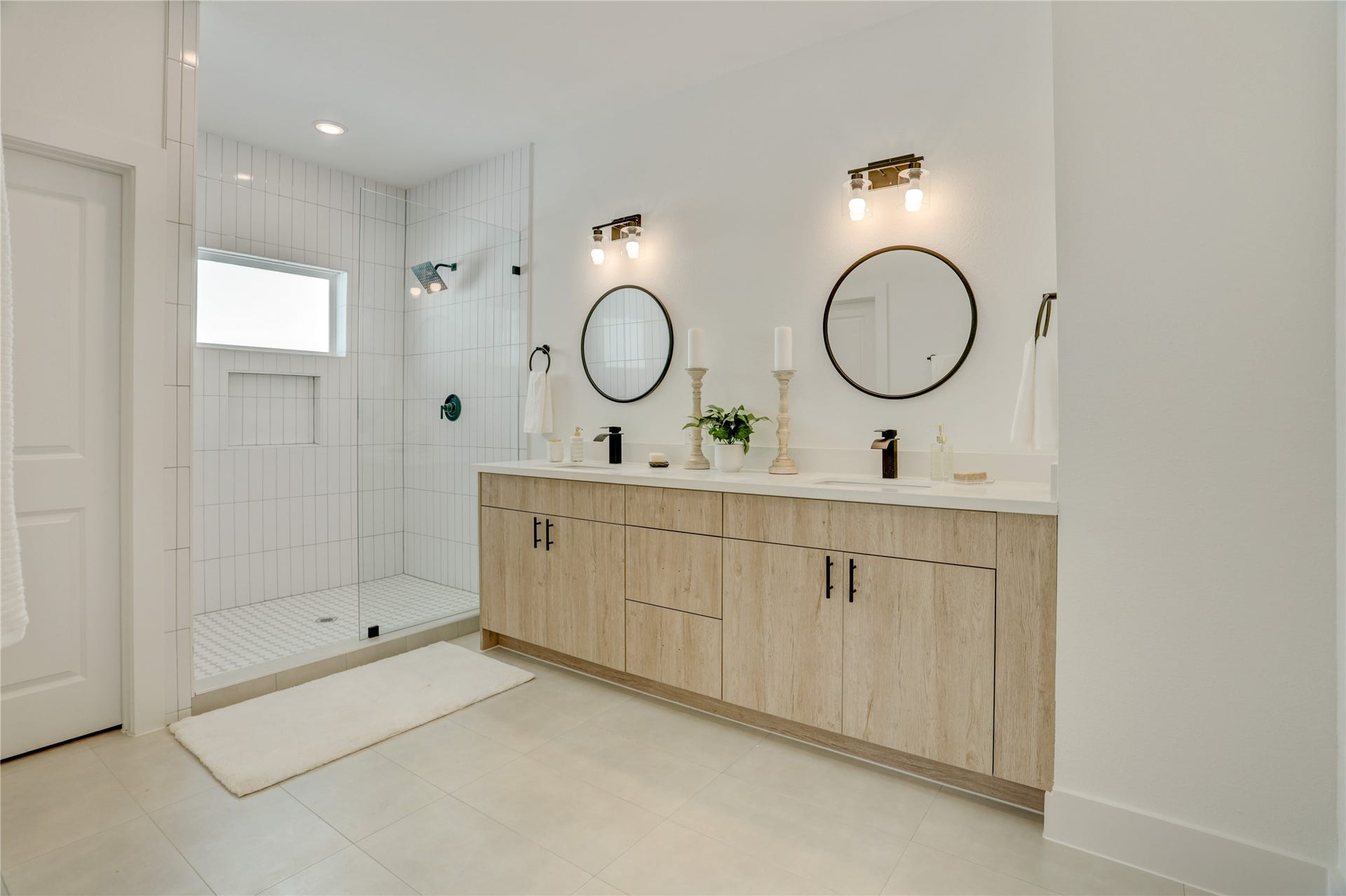 9610 Burden Street, Houston, TX 77093 The primary bath has solid wood cabinets, custom lighting, 3cm quartz counters, and custom fixtures.
