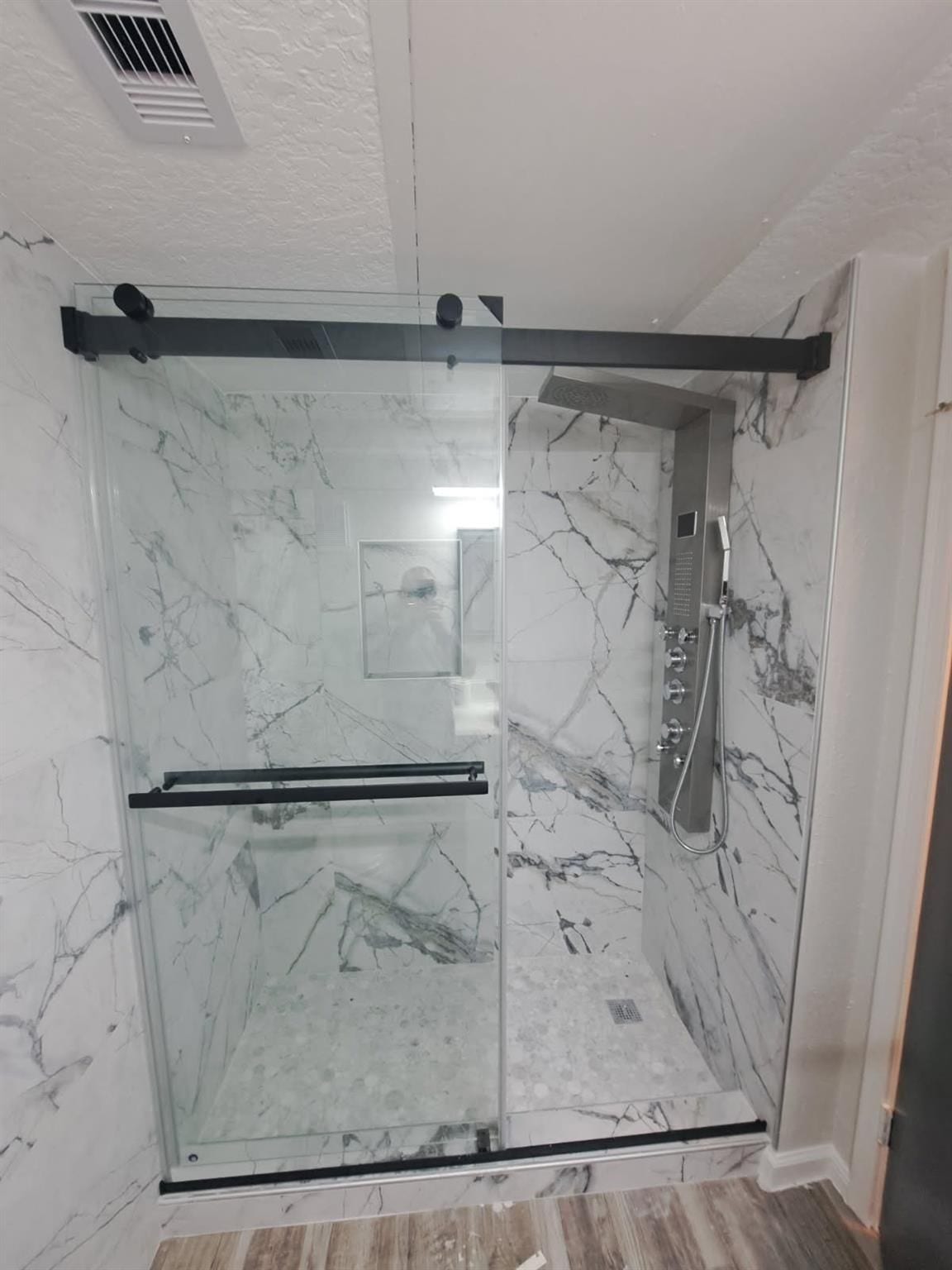 6300 Seawall Boulevard, #3326, Galveston, TX 77551 Spa like shower with multiple rain shower heads and floor to ceiling marble tile