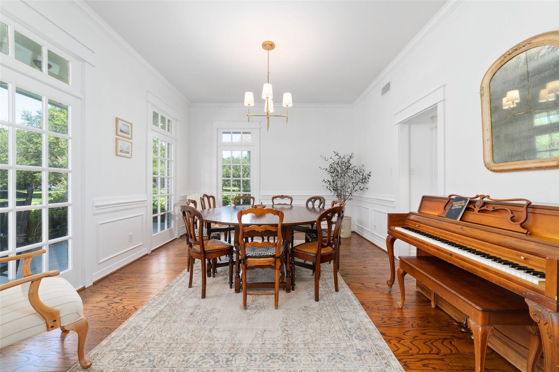 21110 Frey Lane, Tomball, TX 77377 The dining room is surrounded by walls of windows and seats a large table.