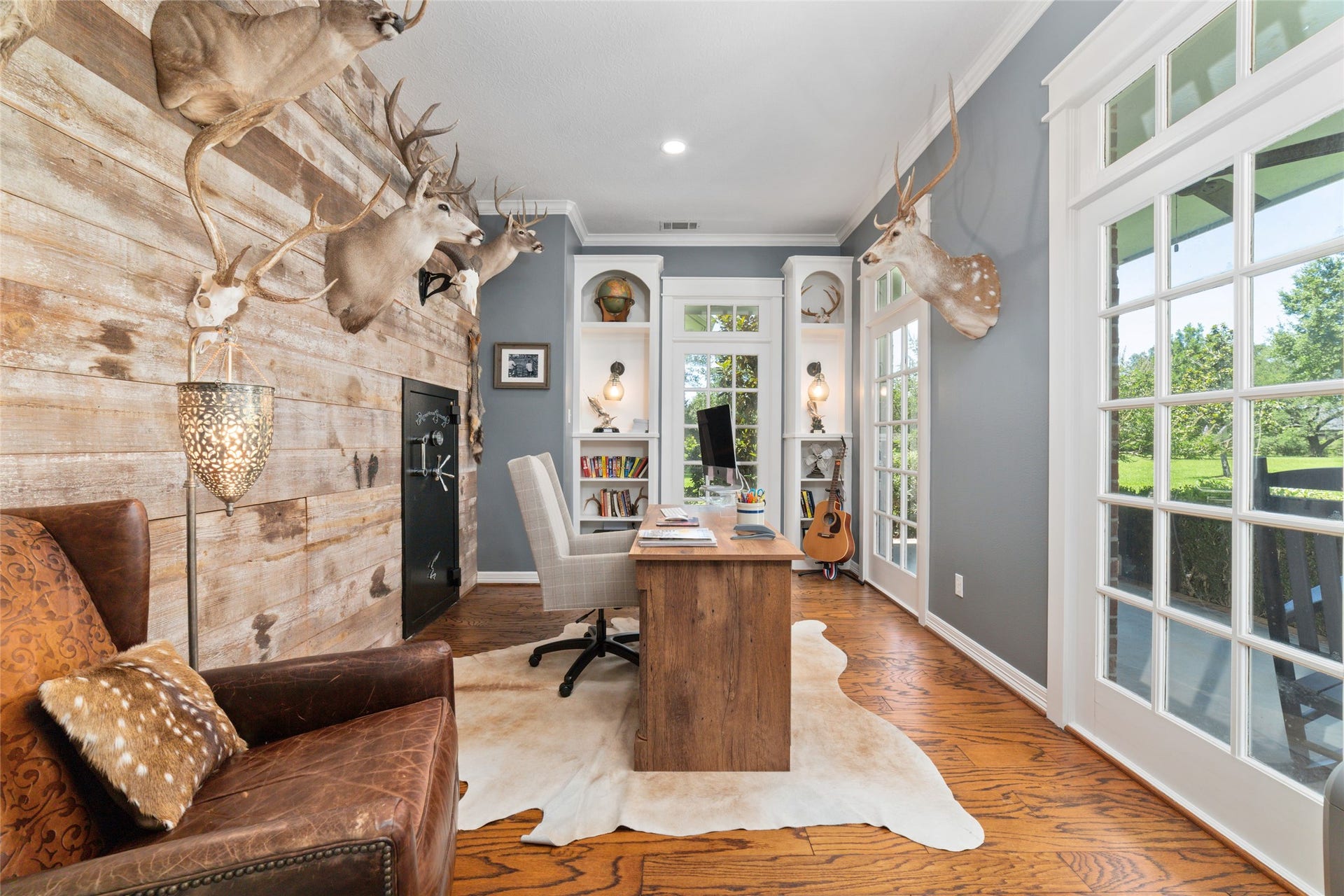 21110 Frey Lane, Tomball, TX 77377 Off the entry is a home office/study with custom wood, paneling, and gorgeous windows overlooking the front yard.