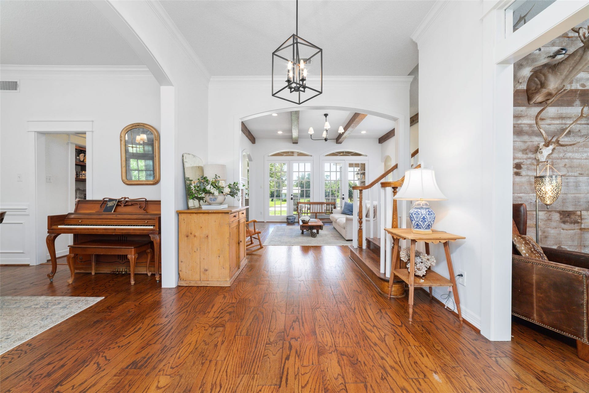 21110 Frey Lane, Tomball, TX 77377 Large entryway of this home, features hardwood floors, neutral, paint, and updated light fixtures throughout.