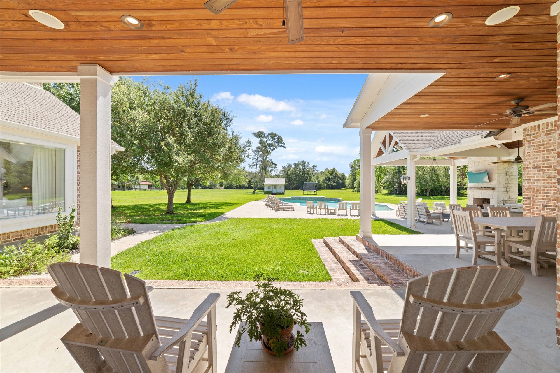 21110 Frey Lane, Tomball, TX 77377 Imagine morning, coffee on his back porch overlooking the 5 acres of Lesh, private Woodland, and mature landscape.
