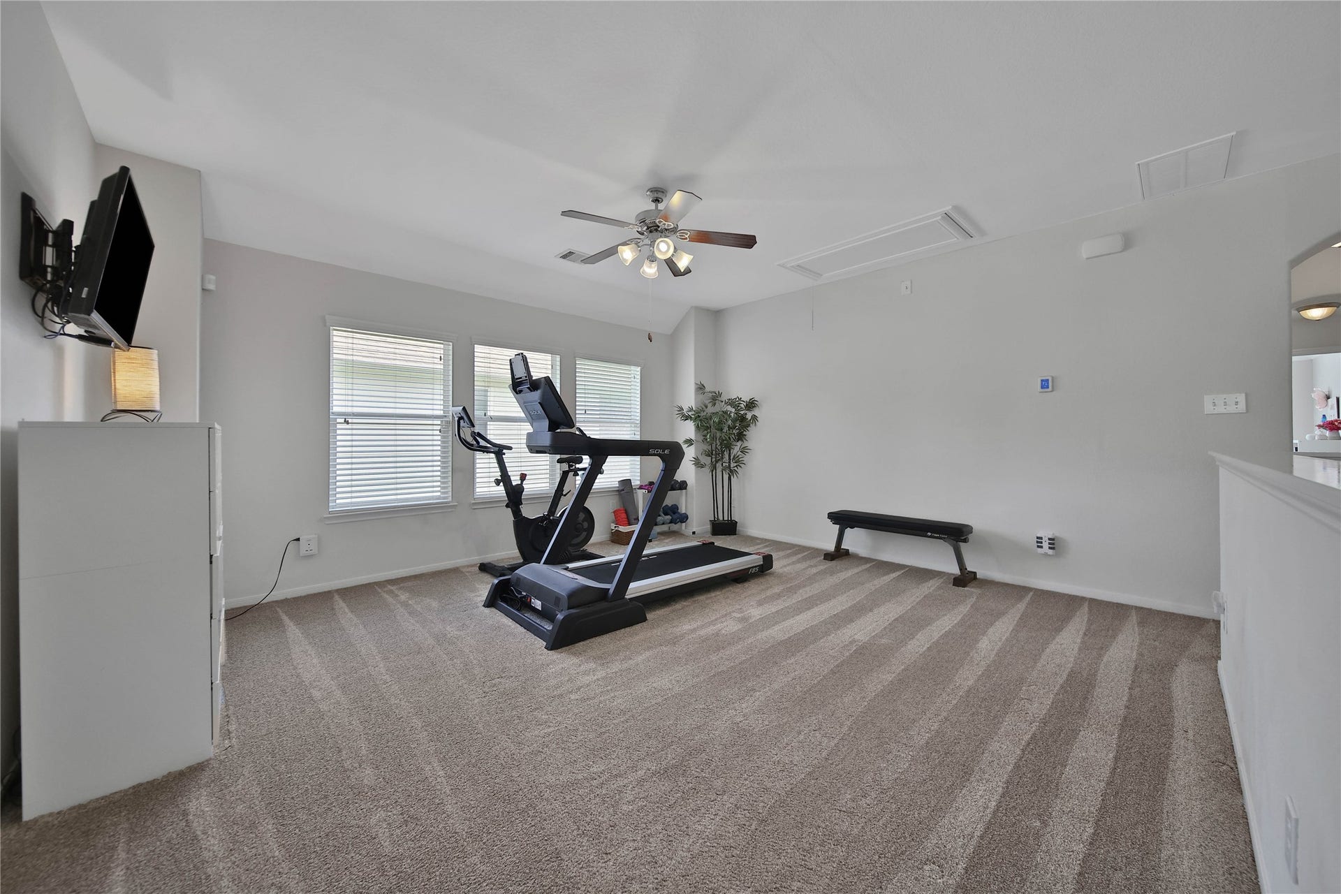17311 Lassen Forest Lane, Humble, TX 77346 Spacious upstairs Game Room. This room offers a great place to play, or a secondary living area. The adjacent media / Theater room takes care of the TV. All carpet replaced 2022.