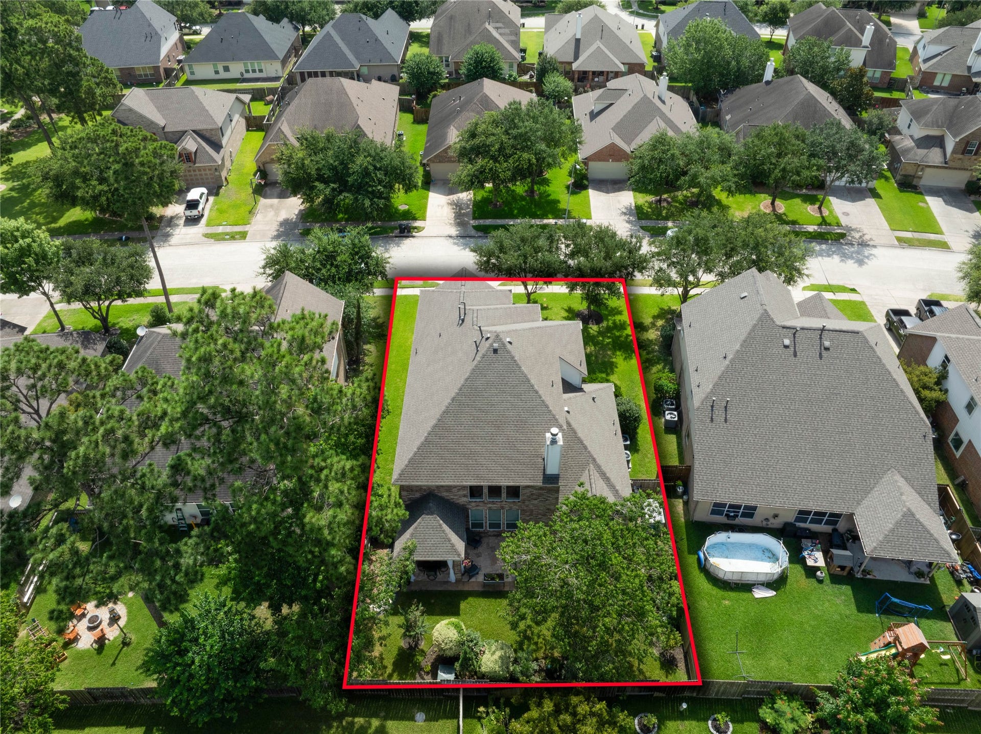 17311 Lassen Forest Lane, Humble, TX 77346 Aerial of back of the property. This energy efficient home has a brand new roof 5/2026. The attic has a tech-shield radiant barrier. HVAC has been upgraded too.