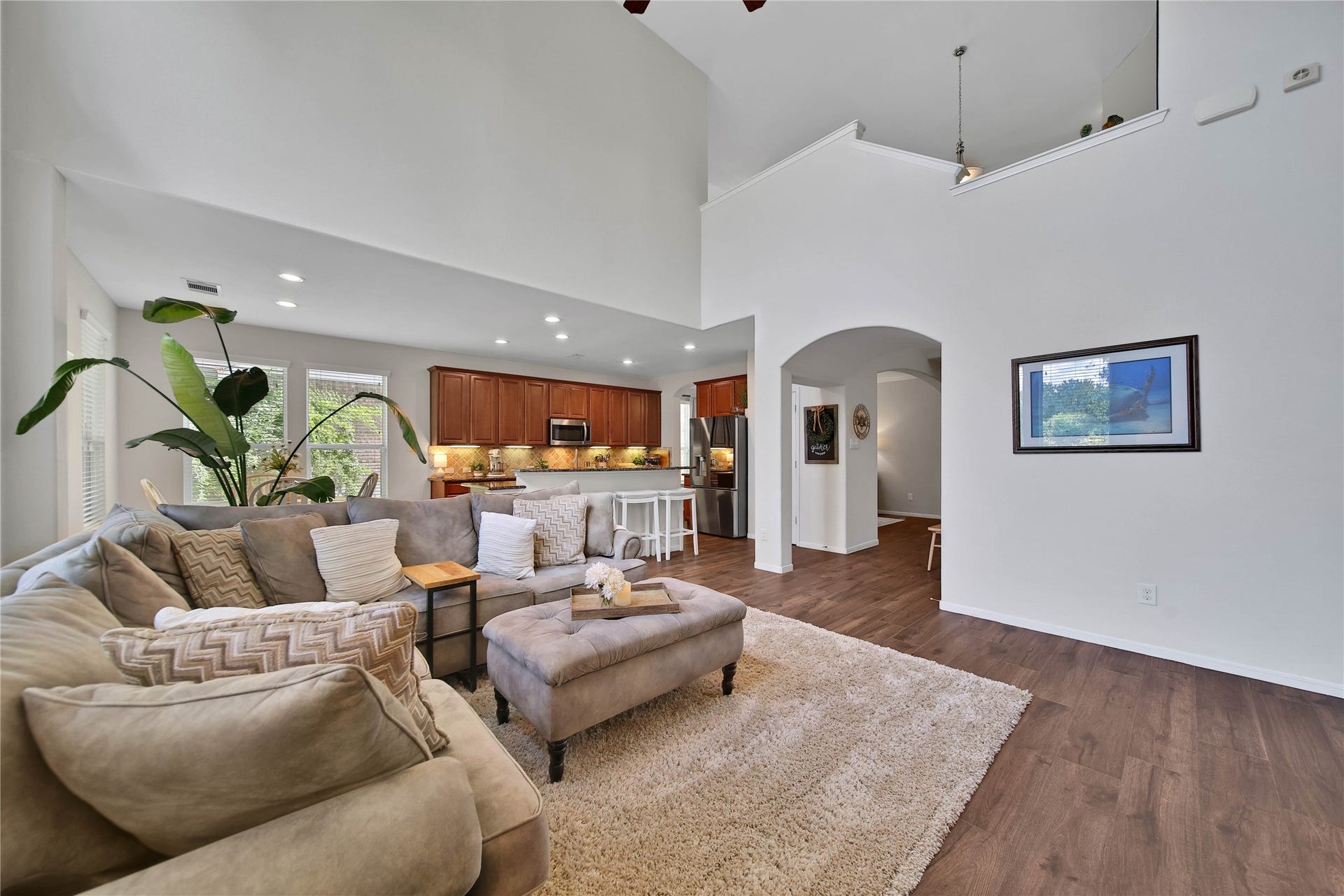 17311 Lassen Forest Lane, Humble, TX 77346 You will feel relaxed and at peace in this welcoming living room with bright walls and warm wood tile floors.
