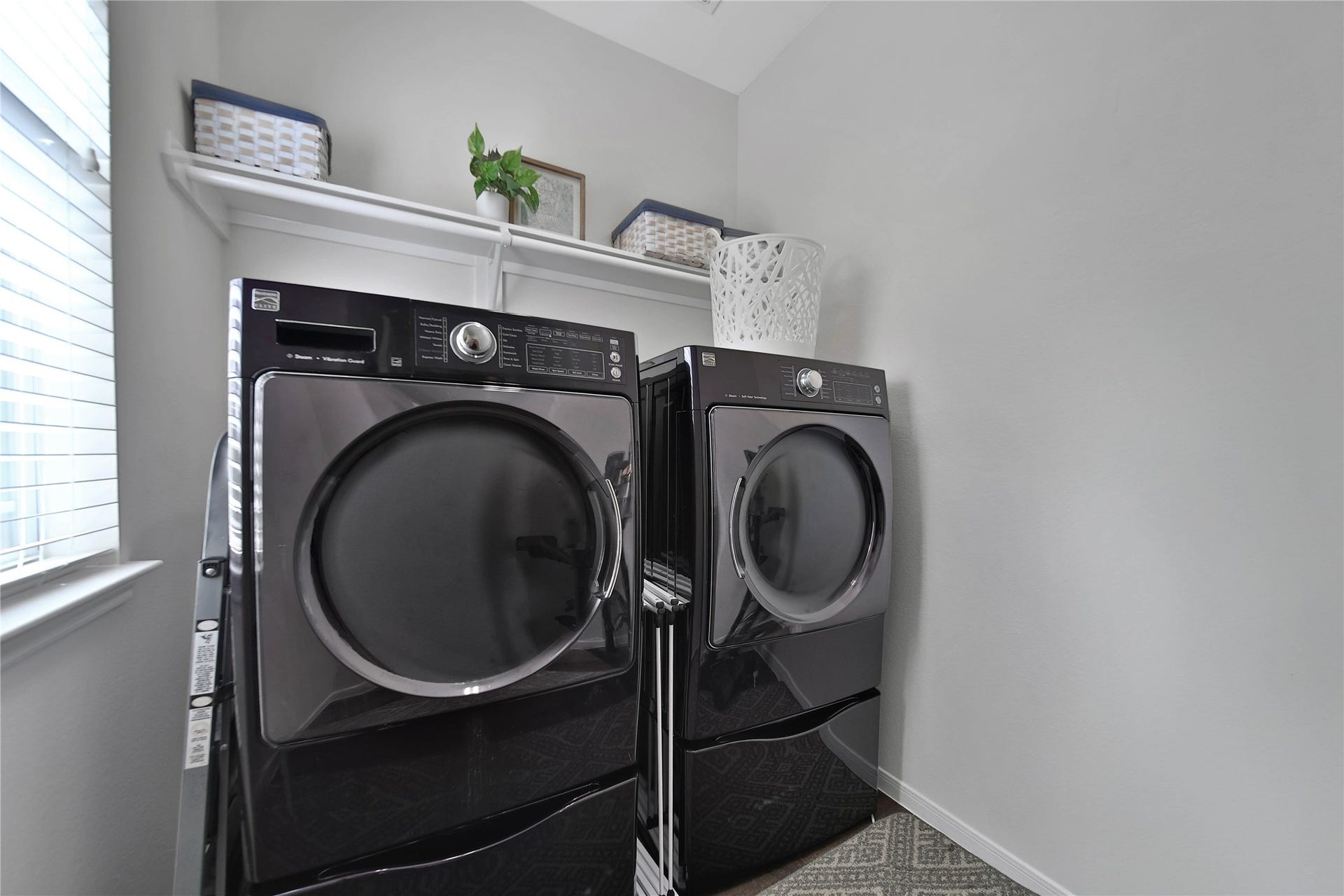 17311 Lassen Forest Lane, Humble, TX 77346 The Laundry room is located in a quiet area of the home away from the main living area.