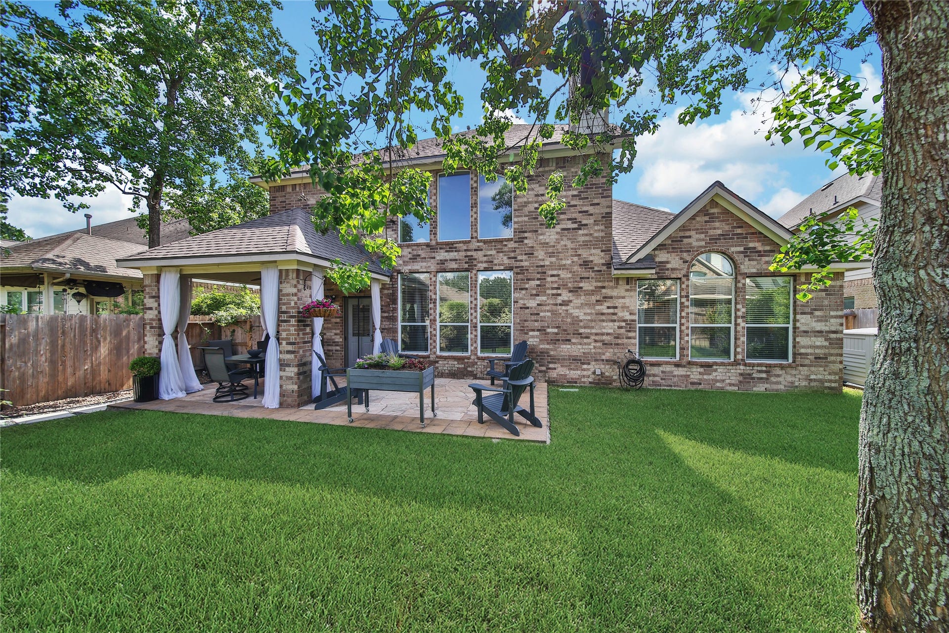 17311 Lassen Forest Lane, Humble, TX 77346 The covered patio and extended patio offer the best of both worlds. Enjoy the sun and shade. This backyard is beautiful and offers a quiet and private place to relax.