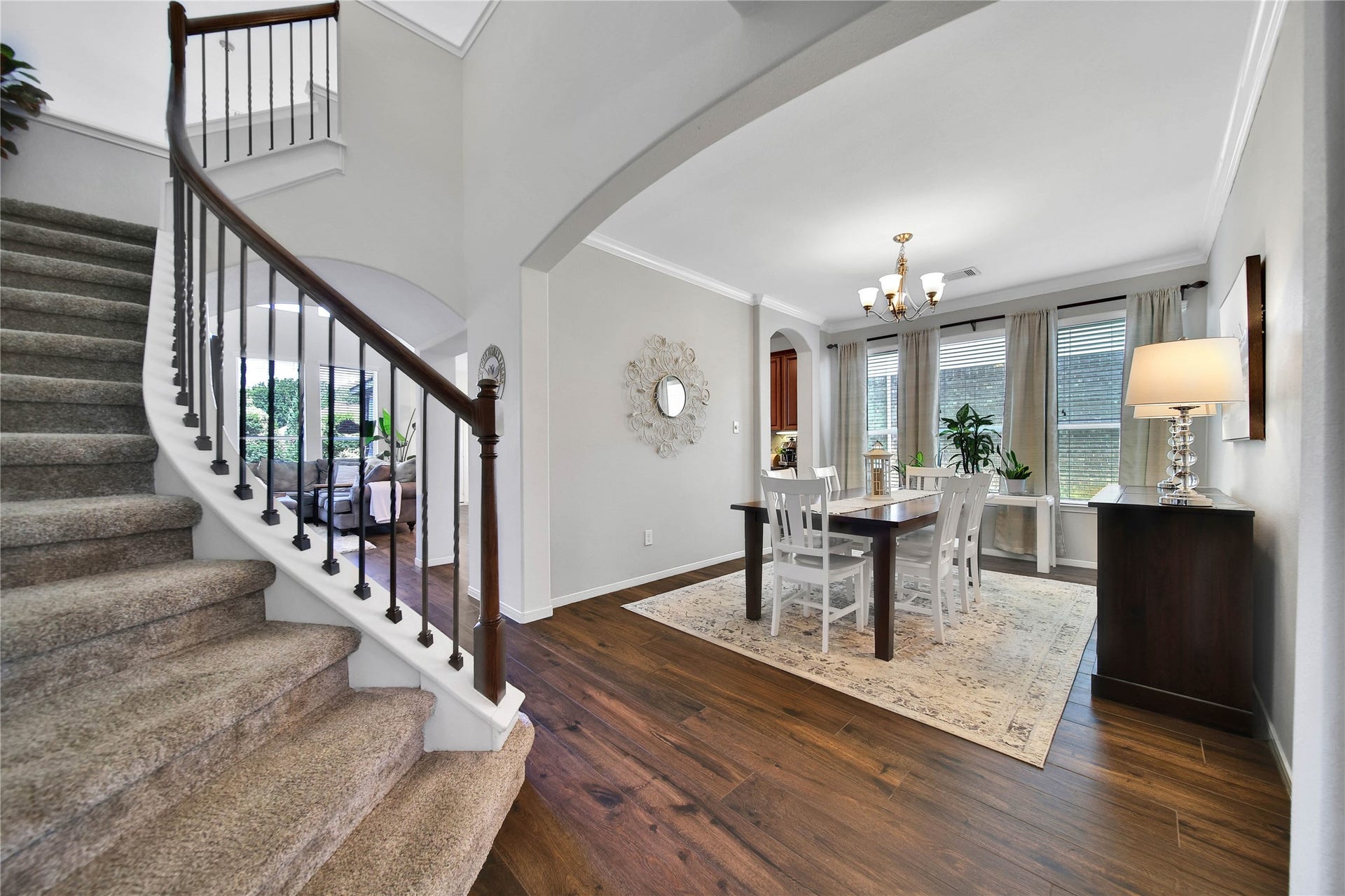 17311 Lassen Forest Lane, Humble, TX 77346 Beautiful iron and wood staircase with plush carpet graces the foyer and leads to the upstairs. The beautiful wood tile floor extends through the main floor of this incredible home.
