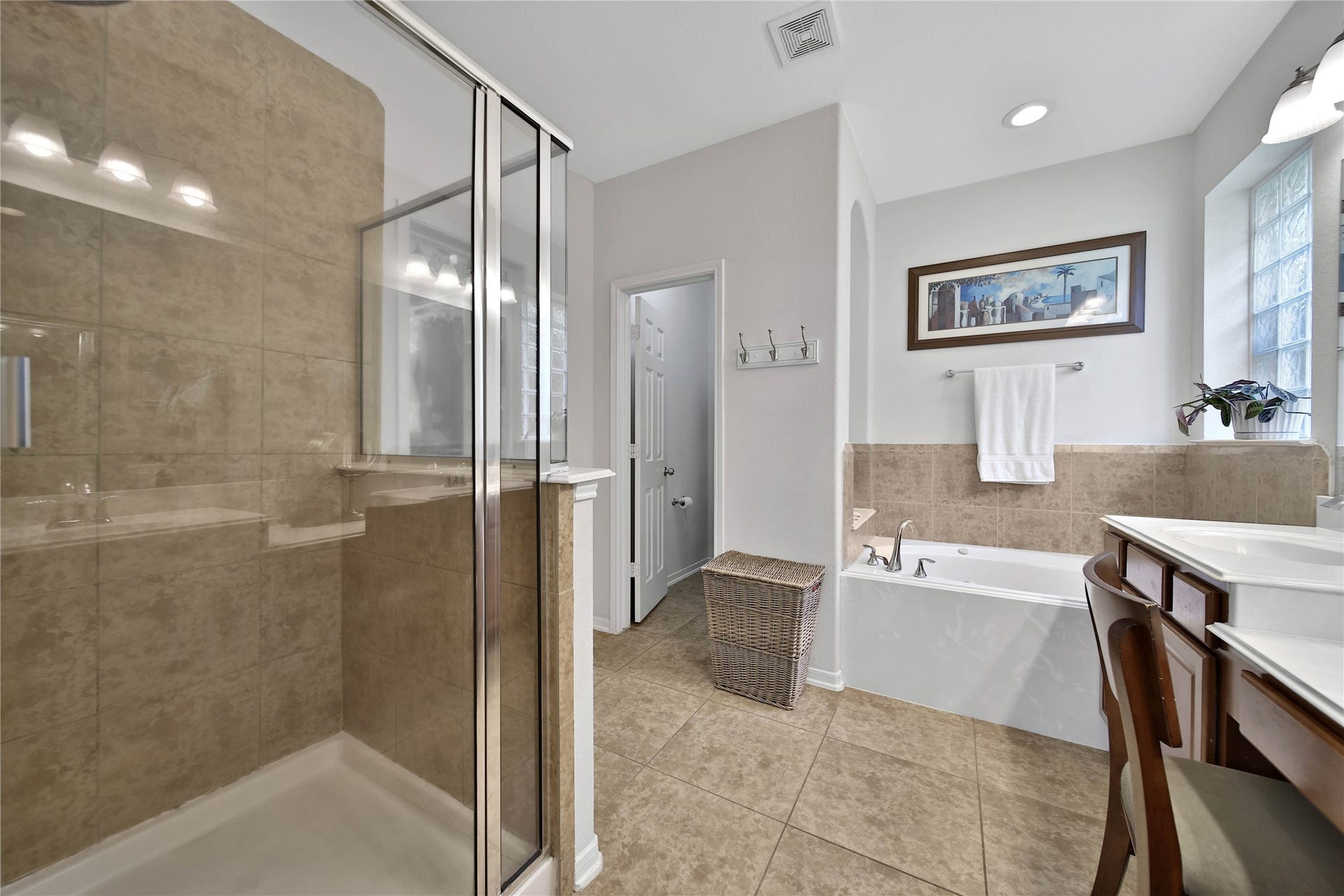 17311 Lassen Forest Lane, Humble, TX 77346 The Primary en-suite bath features an Oversized separate shower, jetted soaking tub, double sinks and a vanity area. Large walk-in closet completes this space!