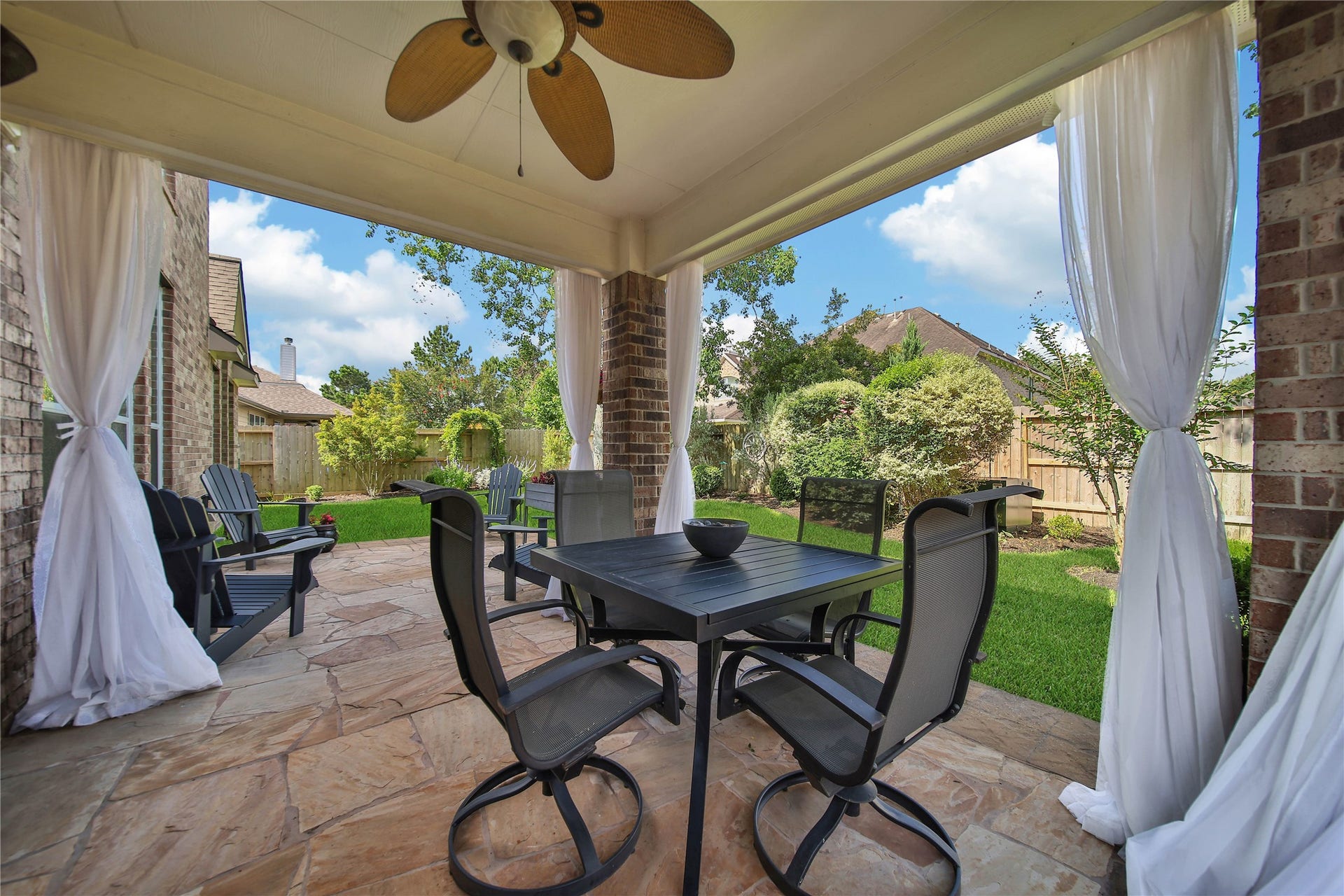 17311 Lassen Forest Lane, Humble, TX 77346 Enjoy an outdoor living room feel under the covered patio and extended flagstone, as you relax and enjoy the outdoors!