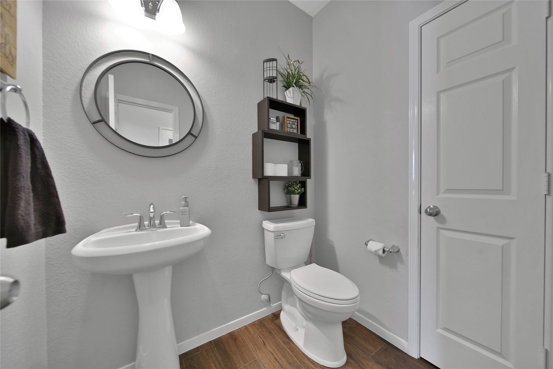 17311 Lassen Forest Lane, Humble, TX 77346 Half bath down is located off the main living area for guest privacy. The linen closet is a welcome feature of this half bath.