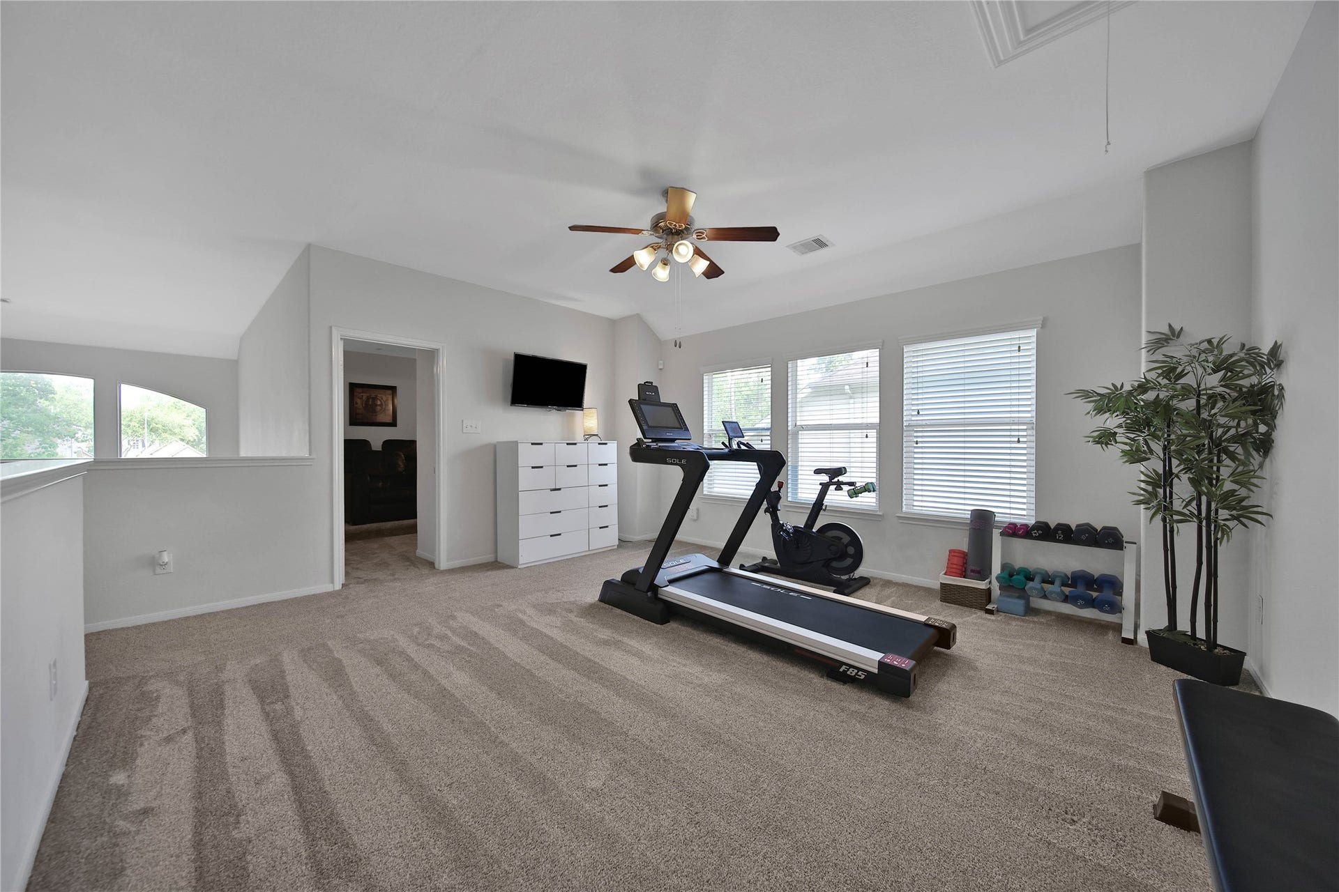 17311 Lassen Forest Lane, Humble, TX 77346 The upstairs Game Room is bright and large enough for play or an upstairs TV area. The seller is currently using as a fitness area. This room offers flexibility with the size and layout. Adjacent media room is a bonus! All carpet replaced 2022.
