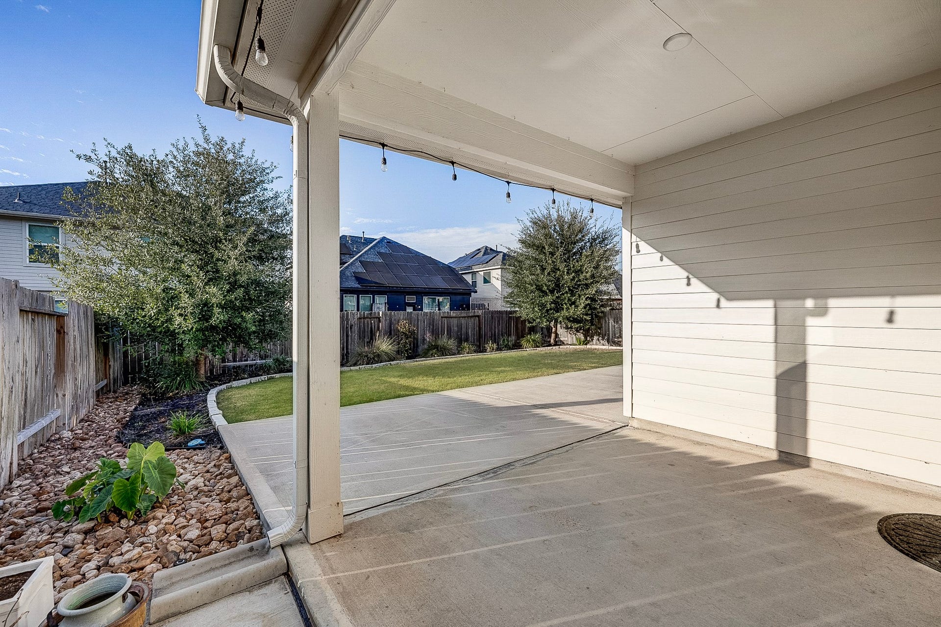 40638 Goldeneye Place, Magnolia, TX 77354 Enjoy outdoor living in this spacious covered patio overlooking a well-maintained backyard, perfect for entertaining or relaxing.