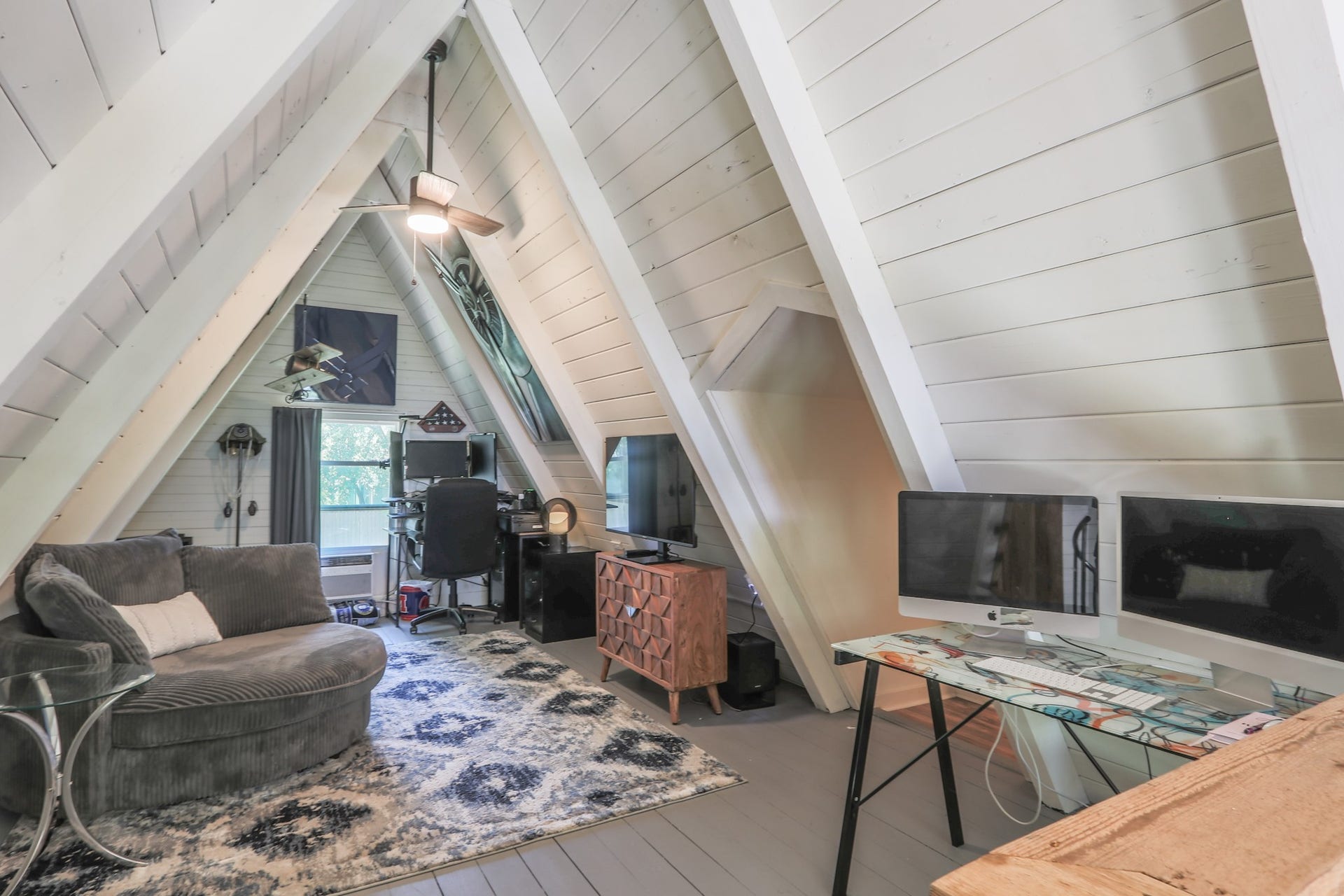 2575 Cliff Drive, Dickinson, TX 77539 The upper loft with ship lap ceilings, ceiling fan, window unit to keep it comfortable.