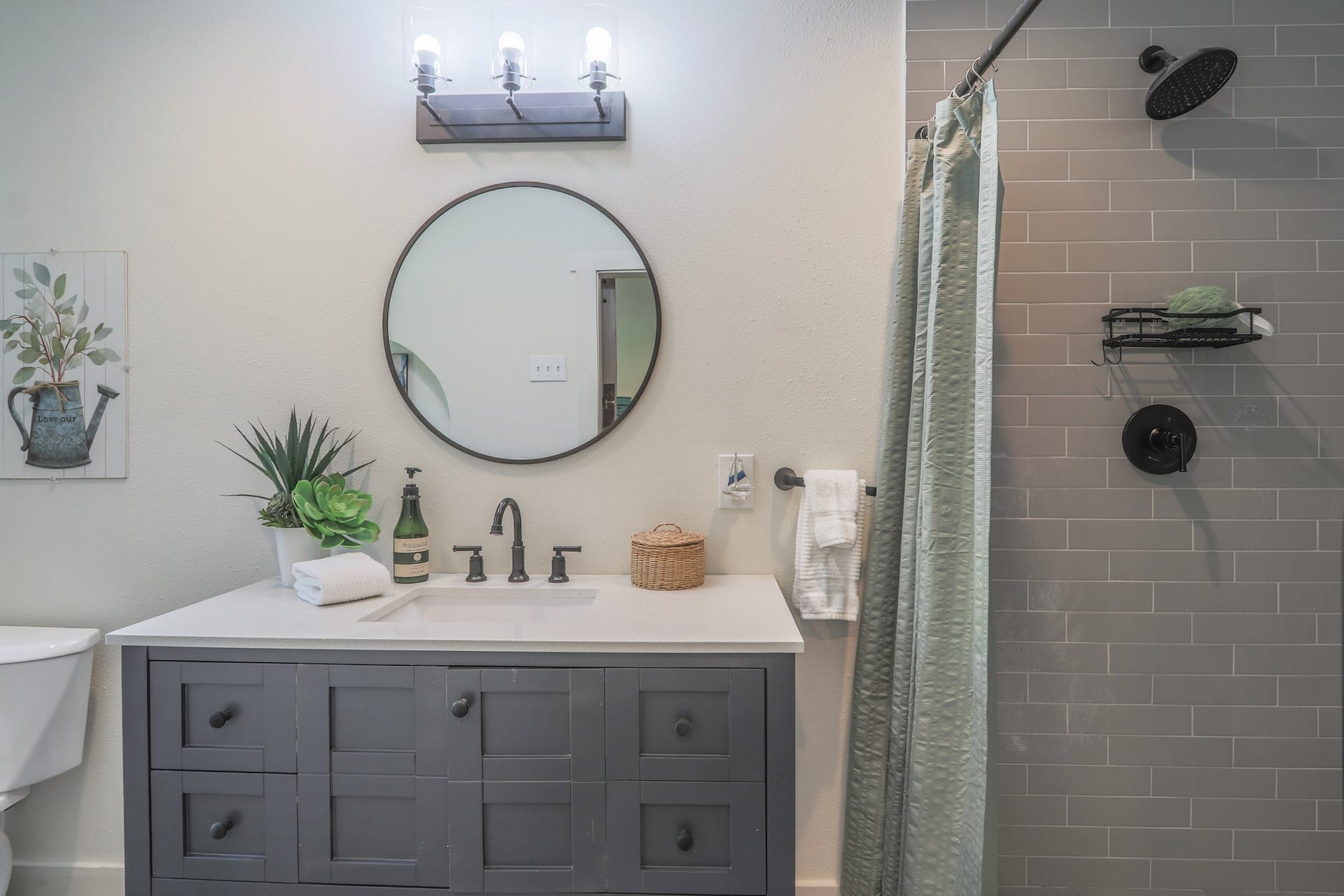 2575 Cliff Drive, Dickinson, TX 77539 Private bath in second room also has a large custom shower and modern lighting, vanity and mirror.