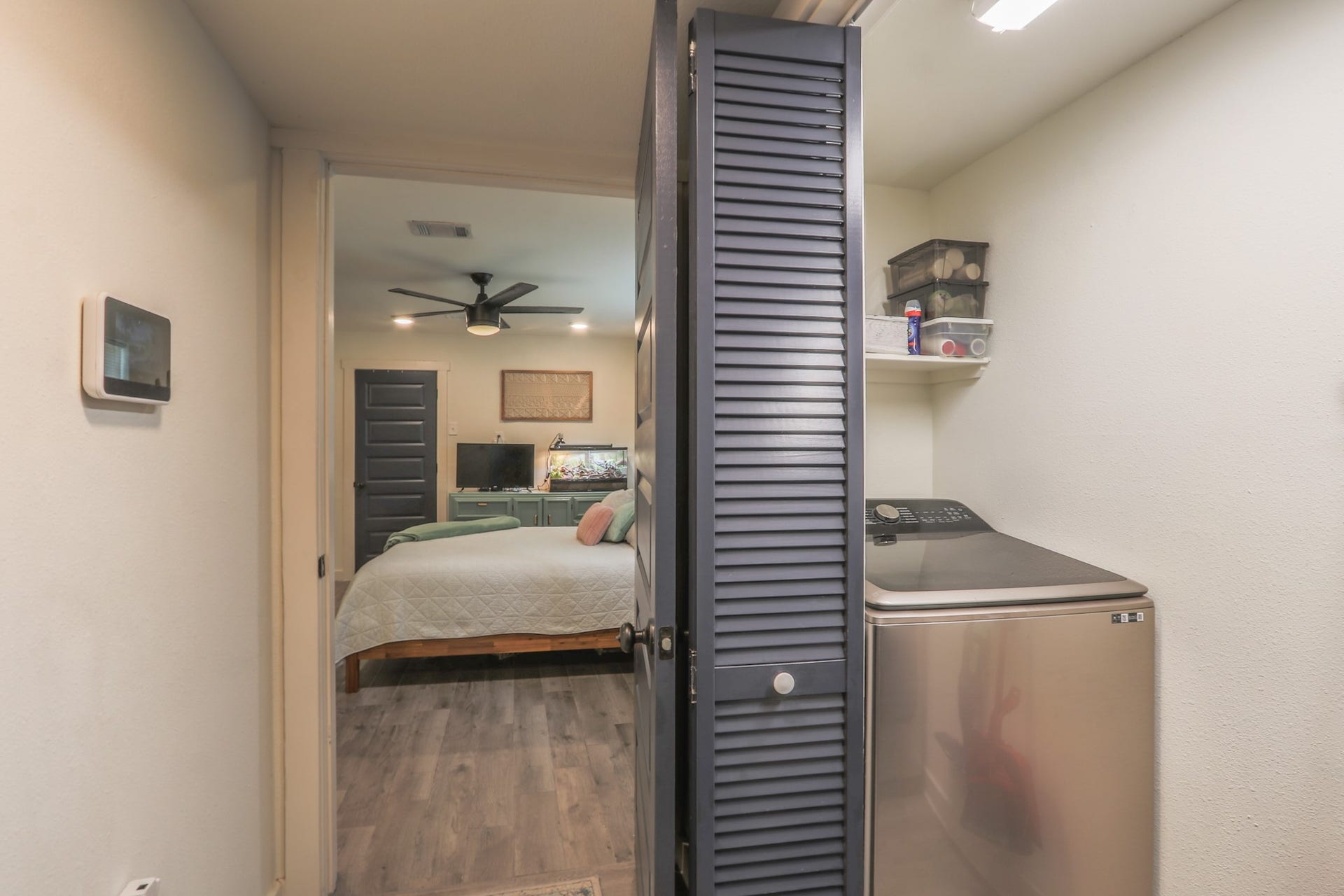 2575 Cliff Drive, Dickinson, TX 77539 Laundry Room is conveniently located in the hallway, the owners are generously leaving a lovely washer & dryer set for the new owner. There is storage over both units and space in between for storing your cleaning tools.