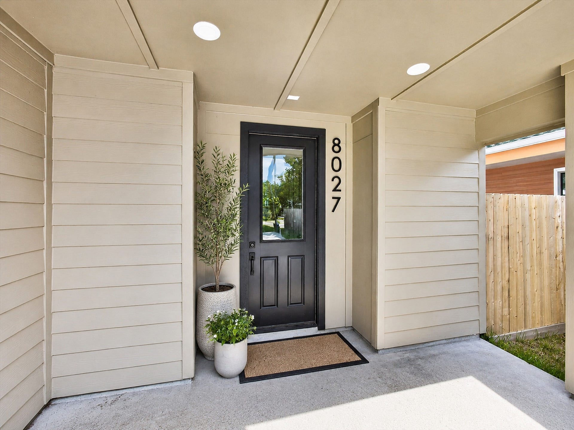 8027 BETTY BOOP Street, Houston, TX 77028 Discover an inviting entry that offers both charm and privacy with the potential for a gated enhancement.