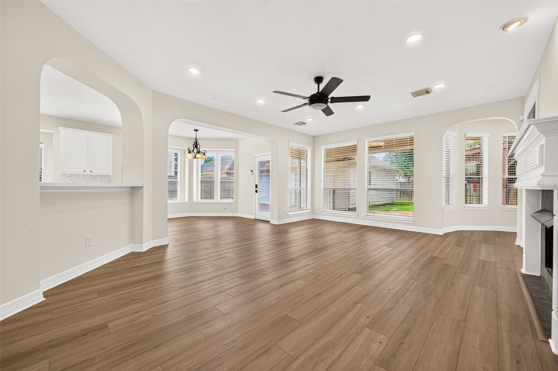826 Ivory Ridge Lane, Houston, TX 77094 LIGHT, BRIGHT & OPEN! Double-pane windows surround the family room with natural light and views of the backyard. Fresh neutral interior paint throughout (2026) & LVP flooring (2026) give the main living areas a clean, cohesive look. At left, the breakfast bar connects directly to the kitchen and doubles as a convenient serving areaperfect for setting out appetizers, desserts, or a buffet when entertaining.