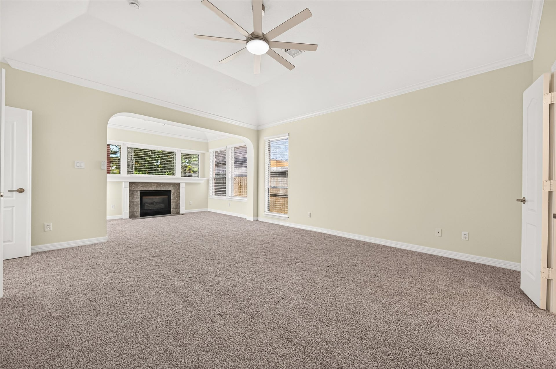 826 Ivory Ridge Lane, Houston, TX 77094 NOW THIS IS A PRIMARY SUITE! This angle really showcases the impressive size of this private Primary Retreat. Theres ample room for a king-size bed, nightstands, dressers, a chest, or even an additional seating area without feeling crowded. The high ceiling adds to the sense of openness, while the fireplace sitting area beyond creates a distinct destination of its own. New plush carpeting (2026) completes the comfortable retreat.