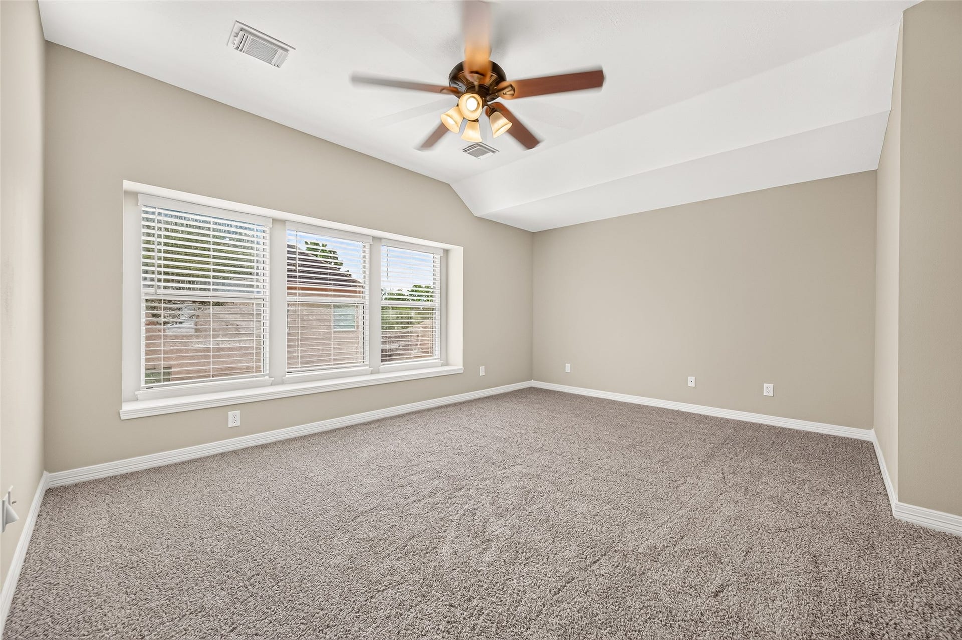 826 Ivory Ridge Lane, Houston, TX 77094 SPREAD OUT & HAVE SOME FUN! The spacious 2nd-floor Gameroom offers plenty of room for a large TV, sectional, game tables, exercise equipment, or multiple activity zones. A wall of windows fills the room with natural light, while the wide ledge is perfect for a window seat. High ceilings add to the open feel. Fresh interior paint & plush carpeting (2026) give the space a fresh start. The home also features 2 zoned HVAC systemsone for each floorwith programmable thermostats for added comfort.