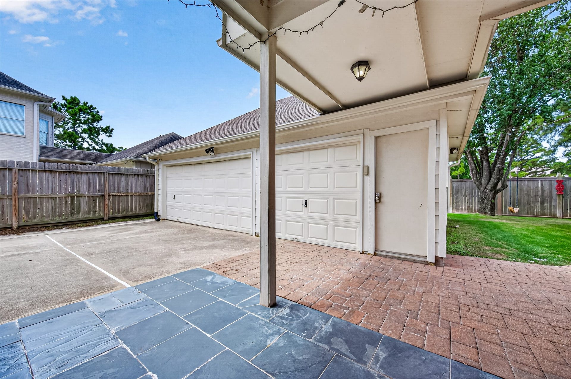 826 Ivory Ridge Lane, Houston, TX 77094 ROOM FOR 3 CARS & MORE! The detached 3-car garage provides generous space for vehicles, storage, tools & hobbies, with garage door openers for added convenience. An extended concrete drive provides additional parking, while the paver walkway/patio creates an easy connection between the garage, home & backyard.