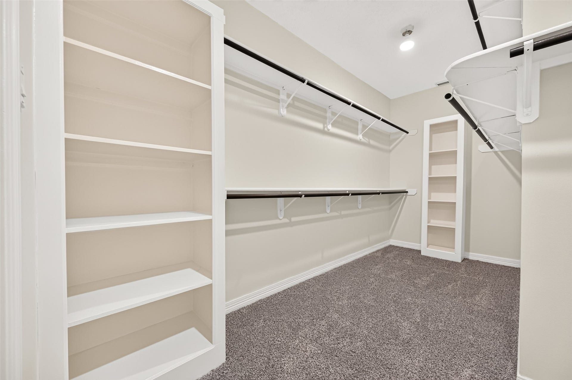 826 Ivory Ridge Lane, Houston, TX 77094 ROOM FOR YOUR WHOLE WARDROBE & ROOM TO SHARE! The large walk-in Primary closet offers abundant hanging & storage space with double hanging rods, upper shelving & built-in shelves for shoes, handbags, folded clothing & accessories. Theres even open floor space in the centermaking it easier to see, organize & actually enjoy everything you own. Be sure to check out the floor plan to see just how generous this closet really is!