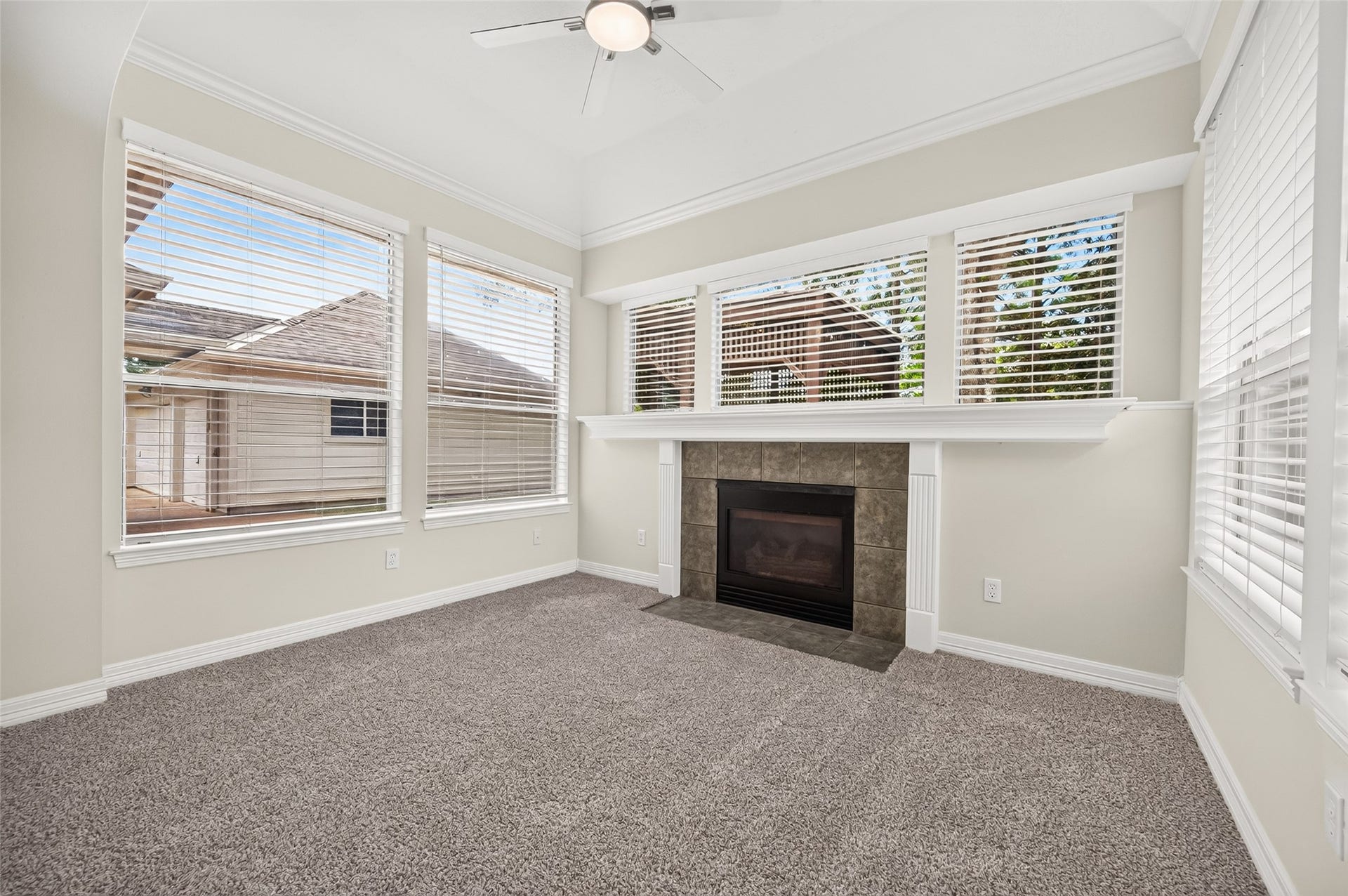 826 Ivory Ridge Lane, Houston, TX 77094 A RETREAT WITHIN A RETREAT! Light & bright with windows surrounding the space, the Primary Suites charming sitting area offers a private spot all its own. Create a cozy reading nook, add comfortable chairs for morning coffee, or make it an intimate TV area for unwinding at the end of the day. A gas-log fireplace adds warmth & ambiance, while the windows offer views toward the backyard & covered patio.