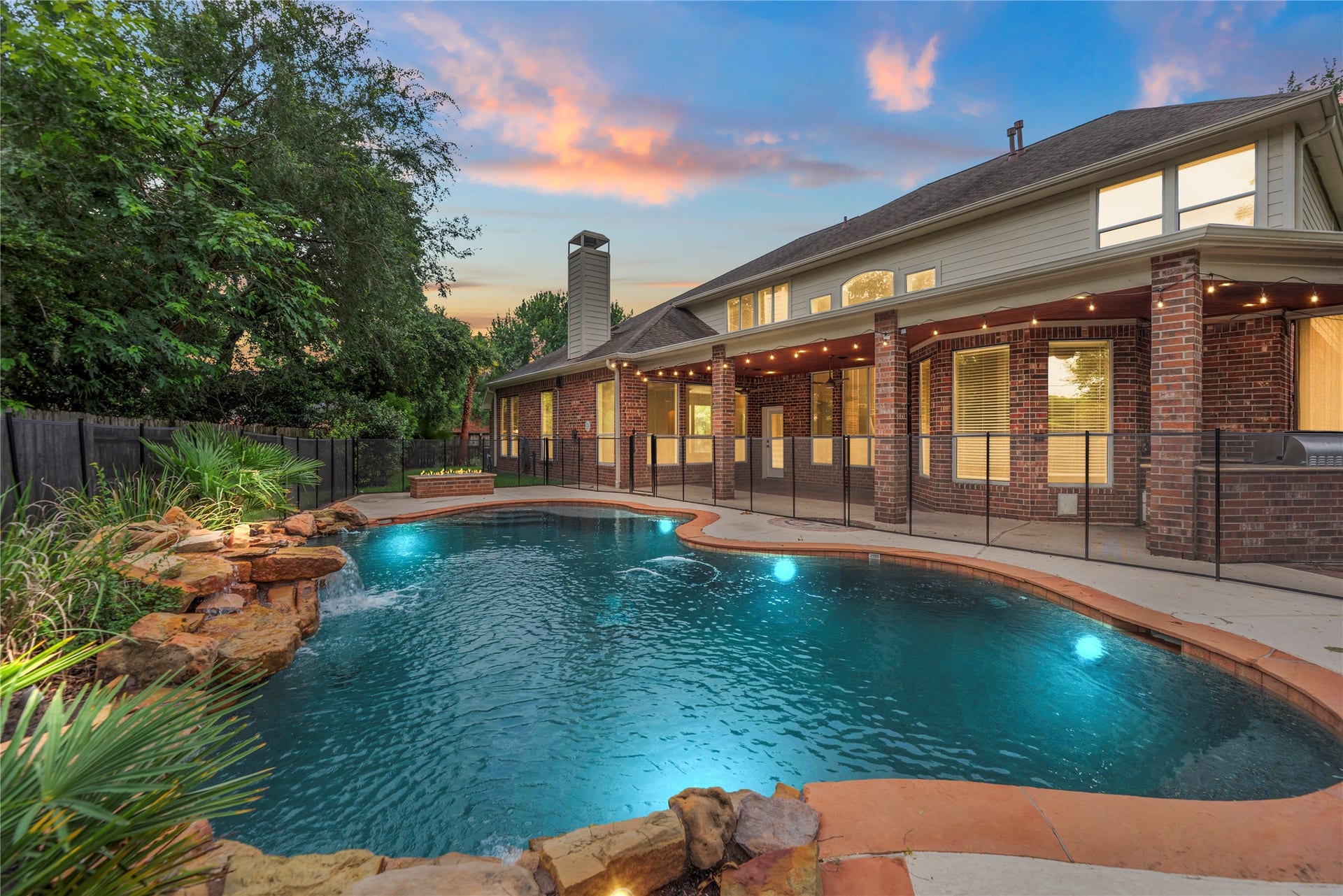 9227 N Fitzgerald Way, Missouri City, TX 77459 Relaxing backyard with sparkling pool, covered patio and well equipped outdoor kitchen!