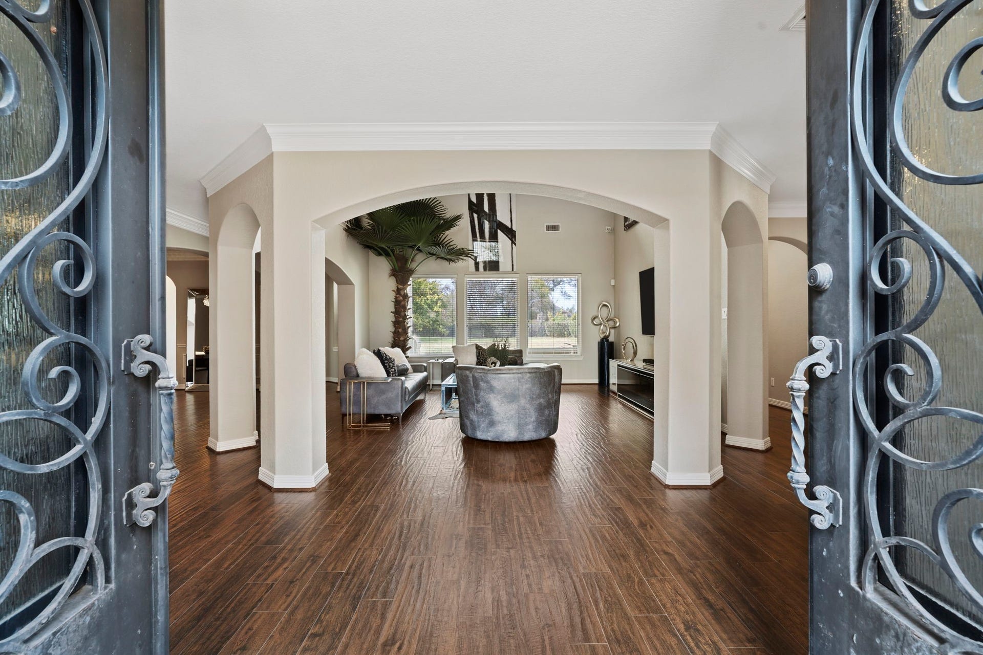4502 Creek Point Lane, Missouri City, TX 77459 Elegant double metal entry doors create a grand and welcoming first impression.
