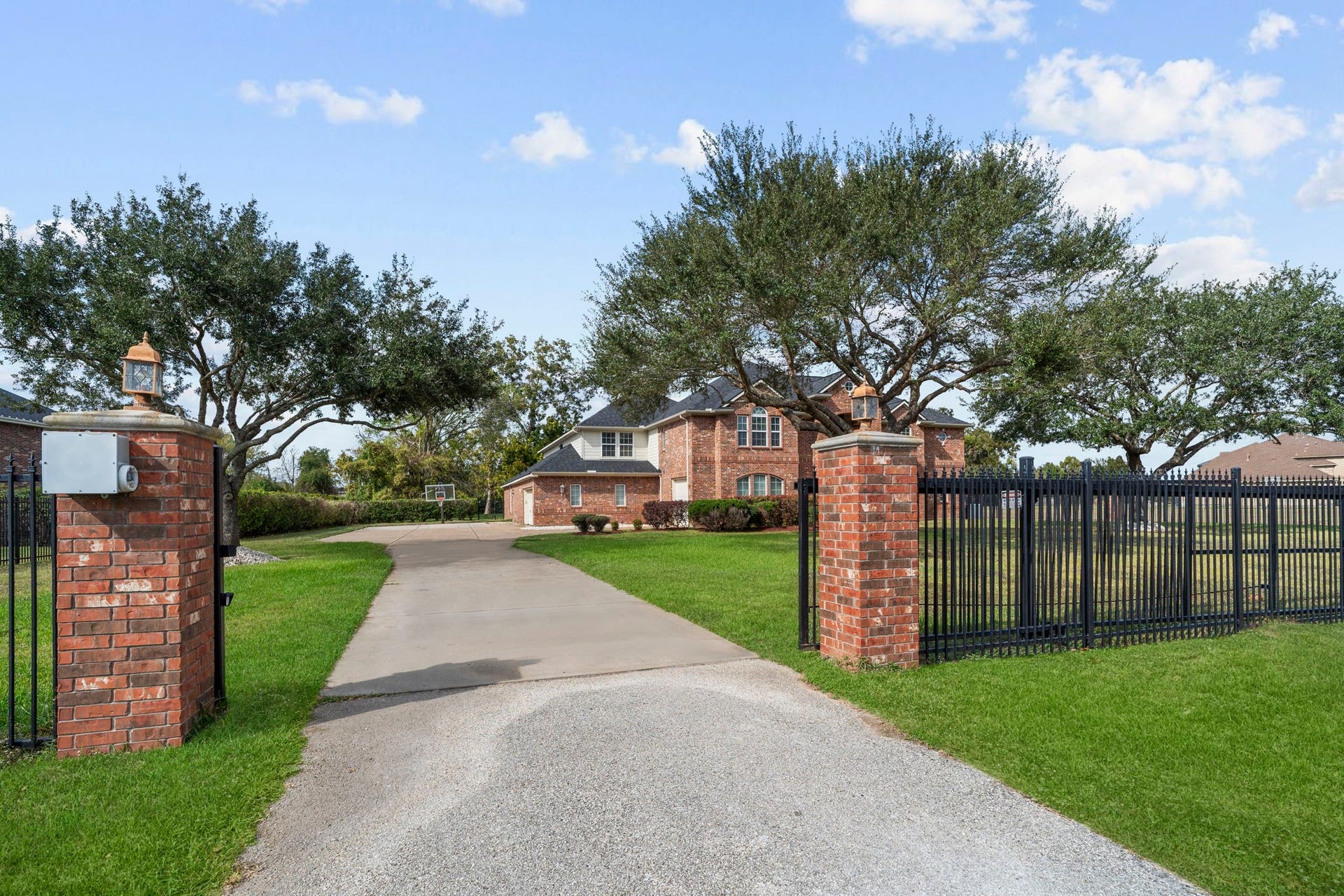 4502 Creek Point Lane, Missouri City, TX 77459 Featuring a private gated entrance for added privacy, peace of mind, and security.